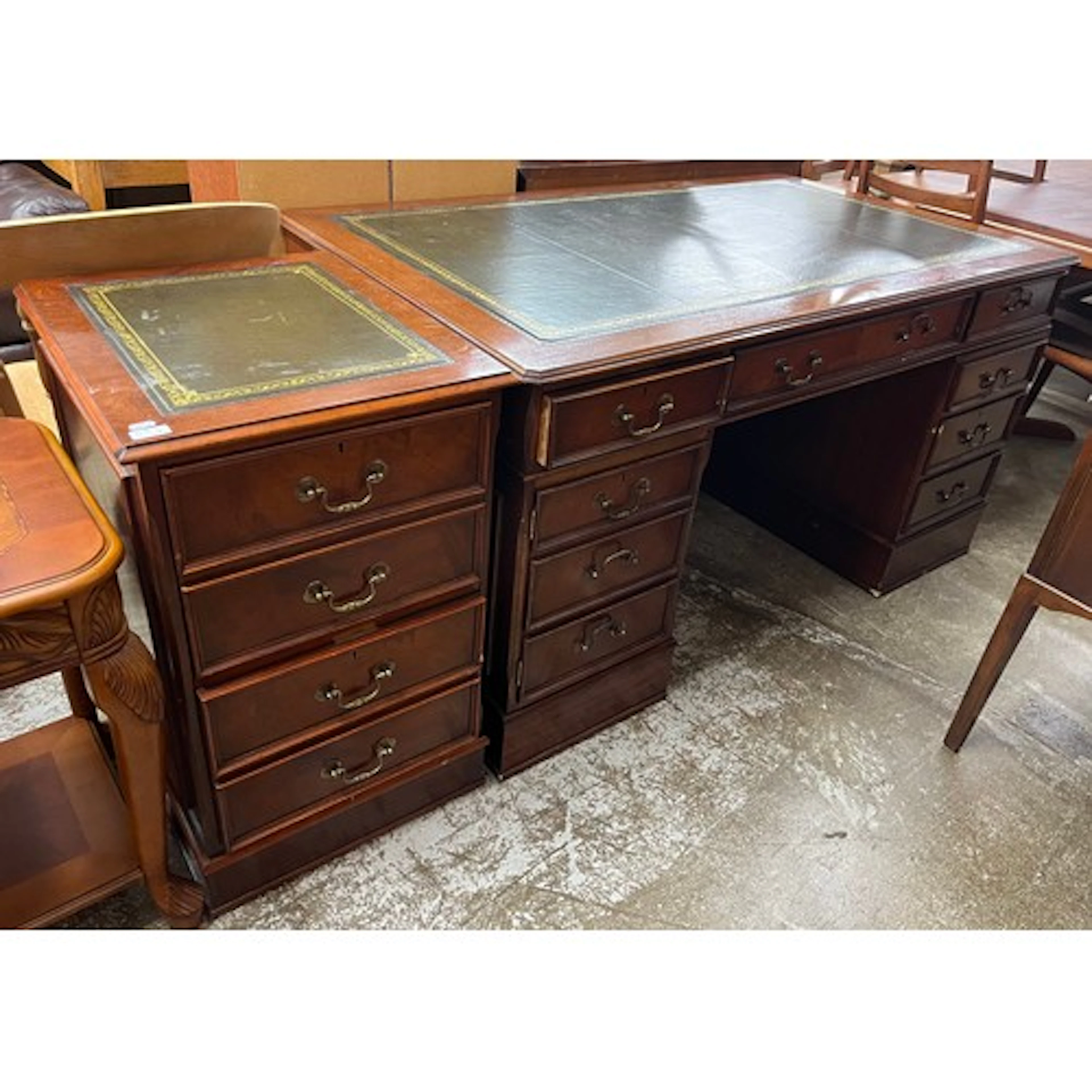 Reproduction pedestal desk, inset leather skiver over an arr...