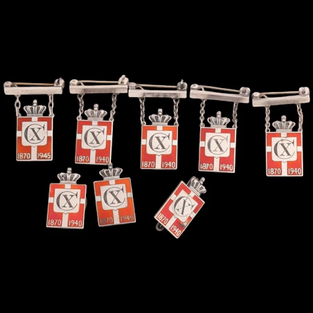 GEORG JENSEN - 8 Danish silver red enamel Kingmark badges an...