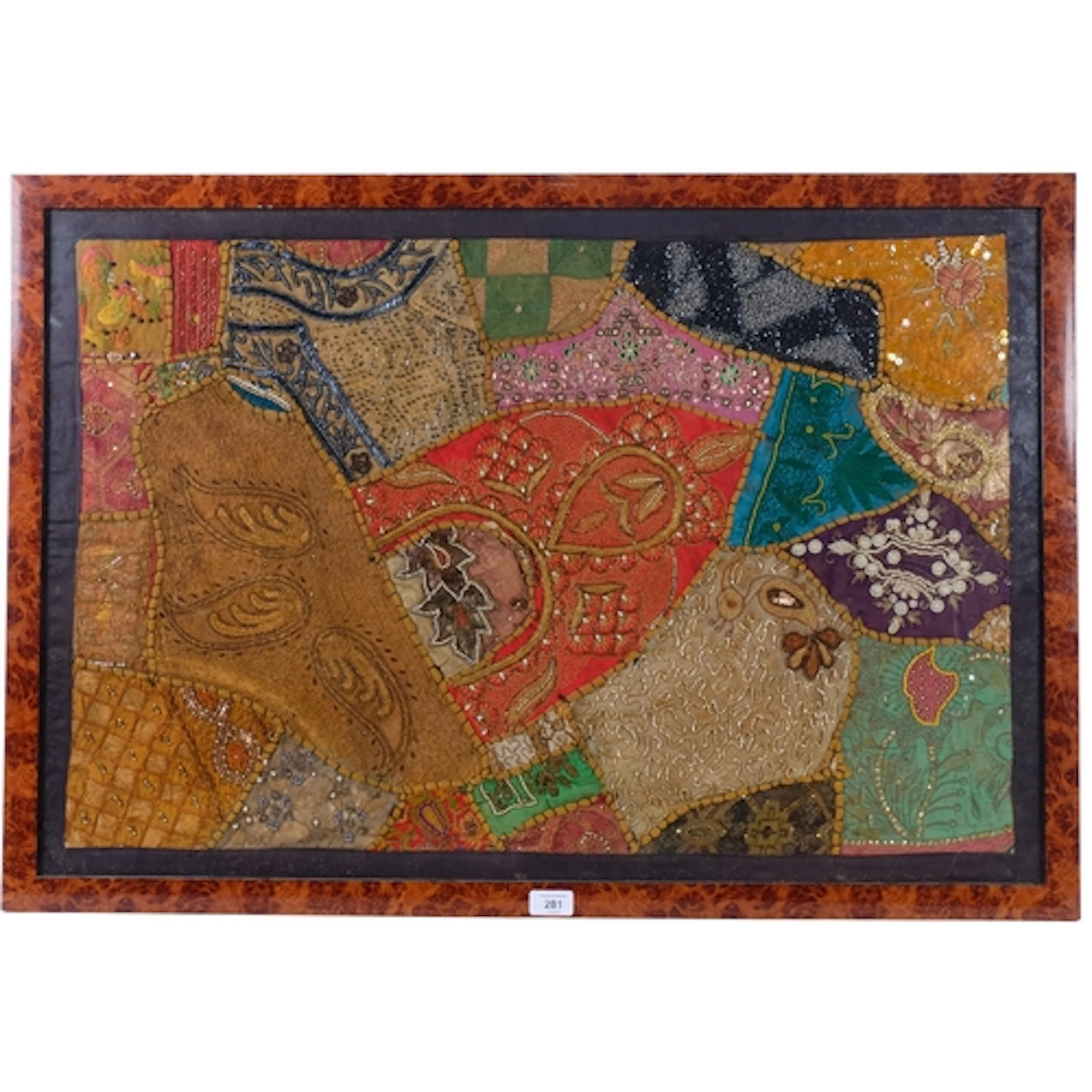 A decorative Indian embroidered patchwork panel, with silver...