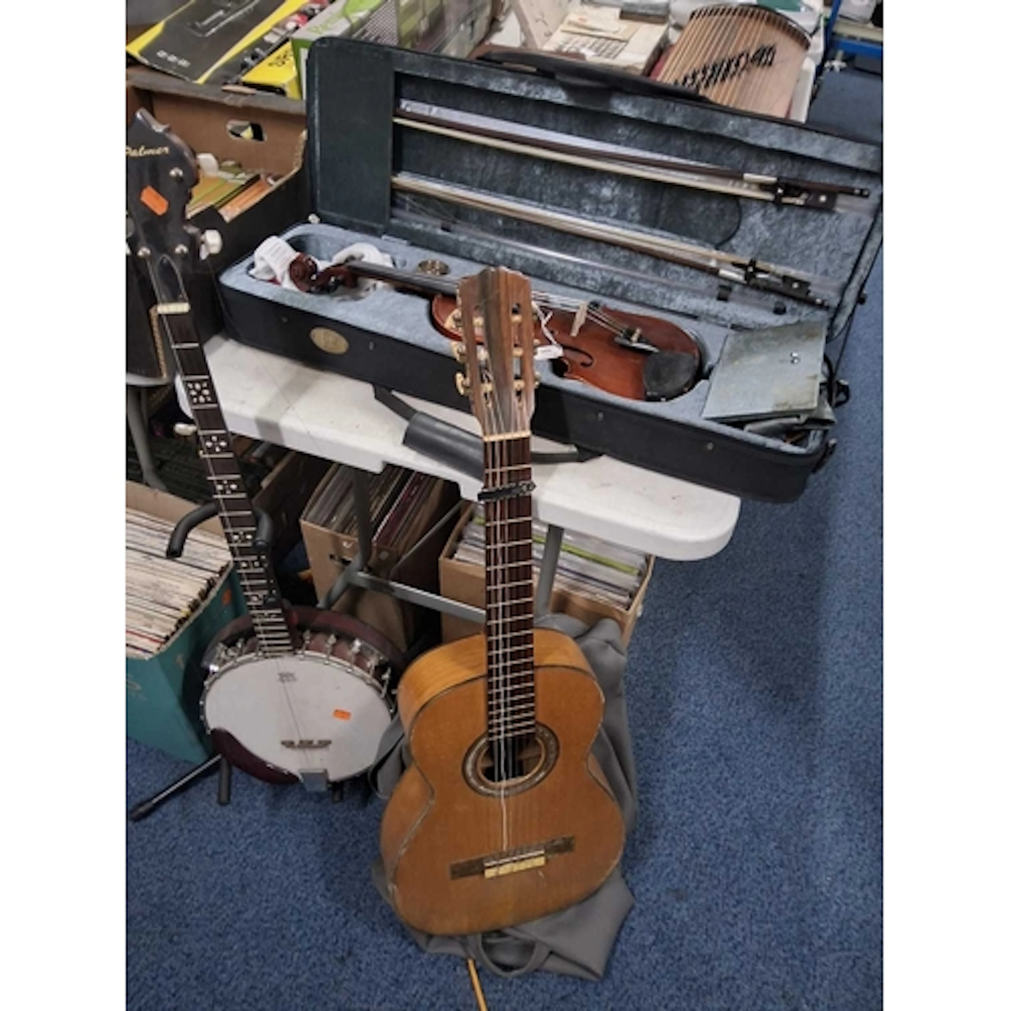 A GROUP OF THREE MUSICAL INSTRUMENTS comprising a Stentor Co...
