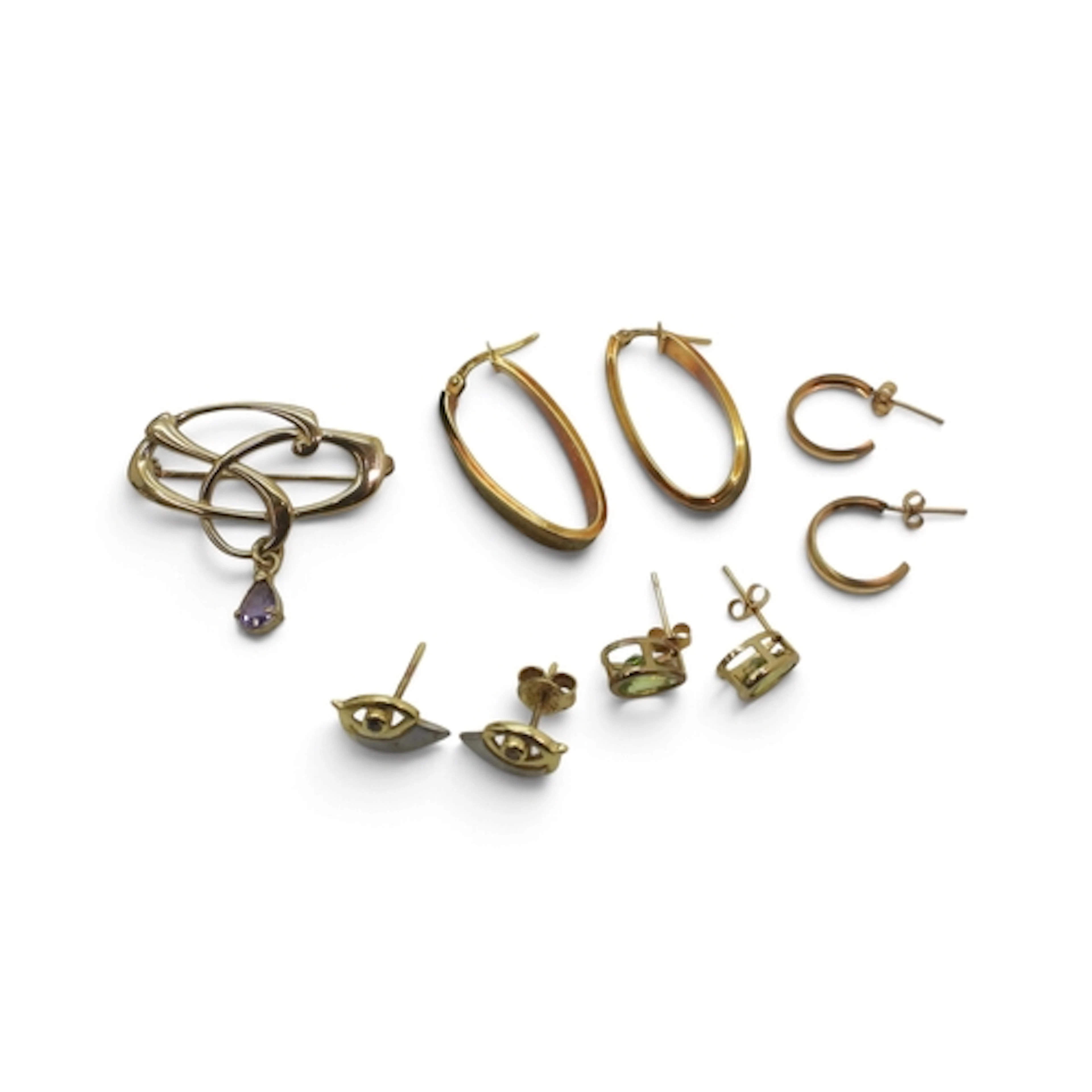 A 9ct gold amethyst brooch by Ortak, and four pairs of 9ct a...