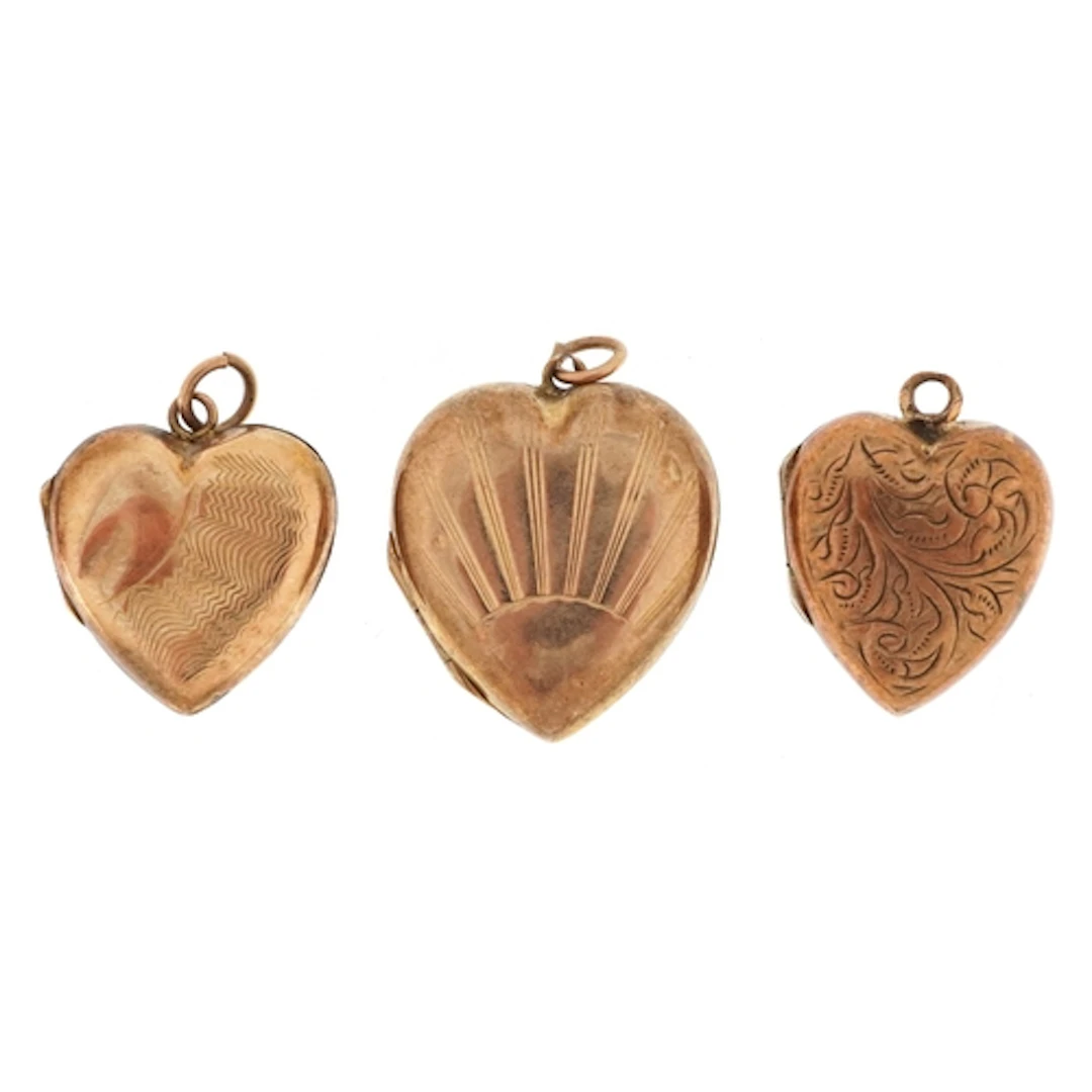 Three 9ct gold back and front love heart lockets the largest...