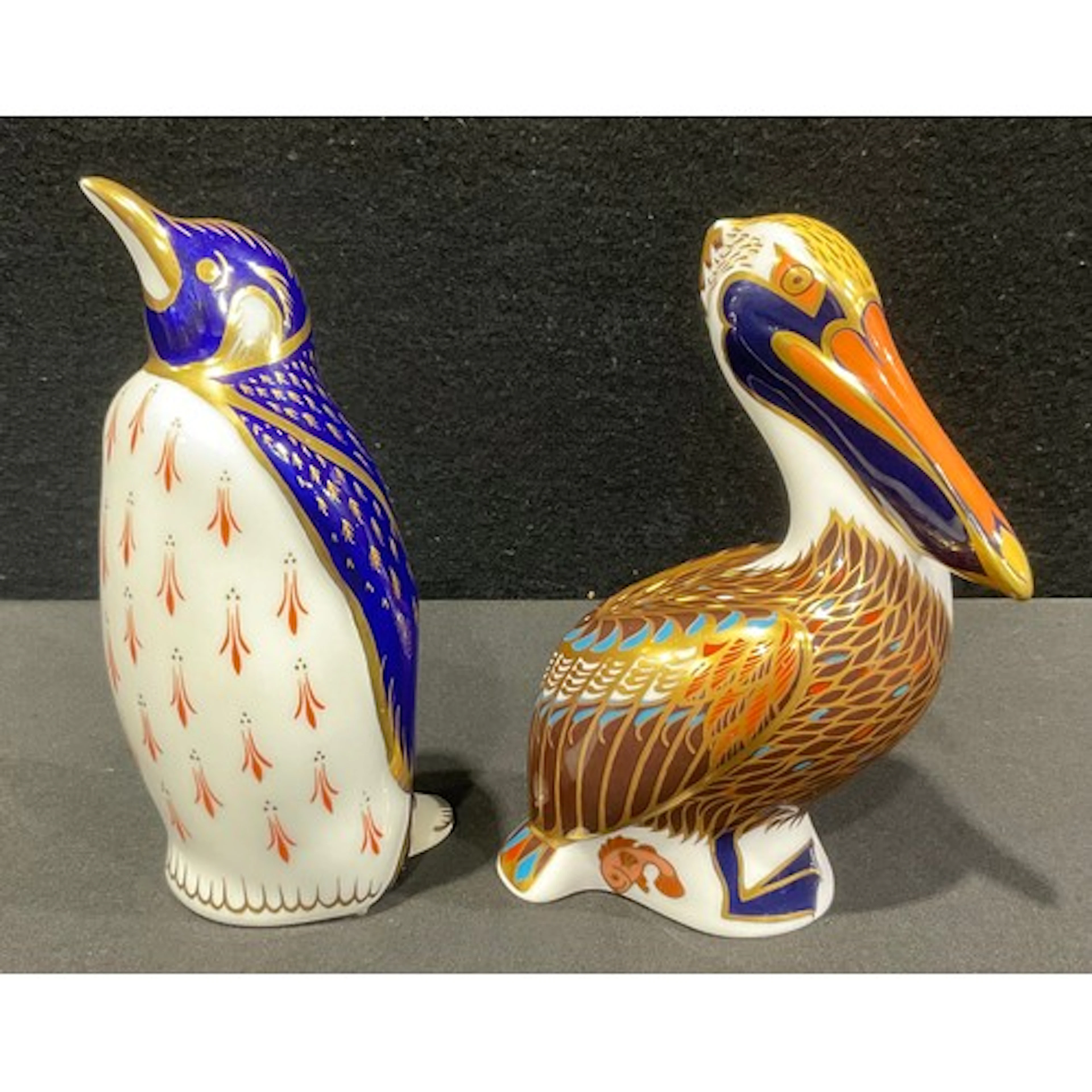 A Royal Crown Derby paperweight, Brown Pelican, red printed ...