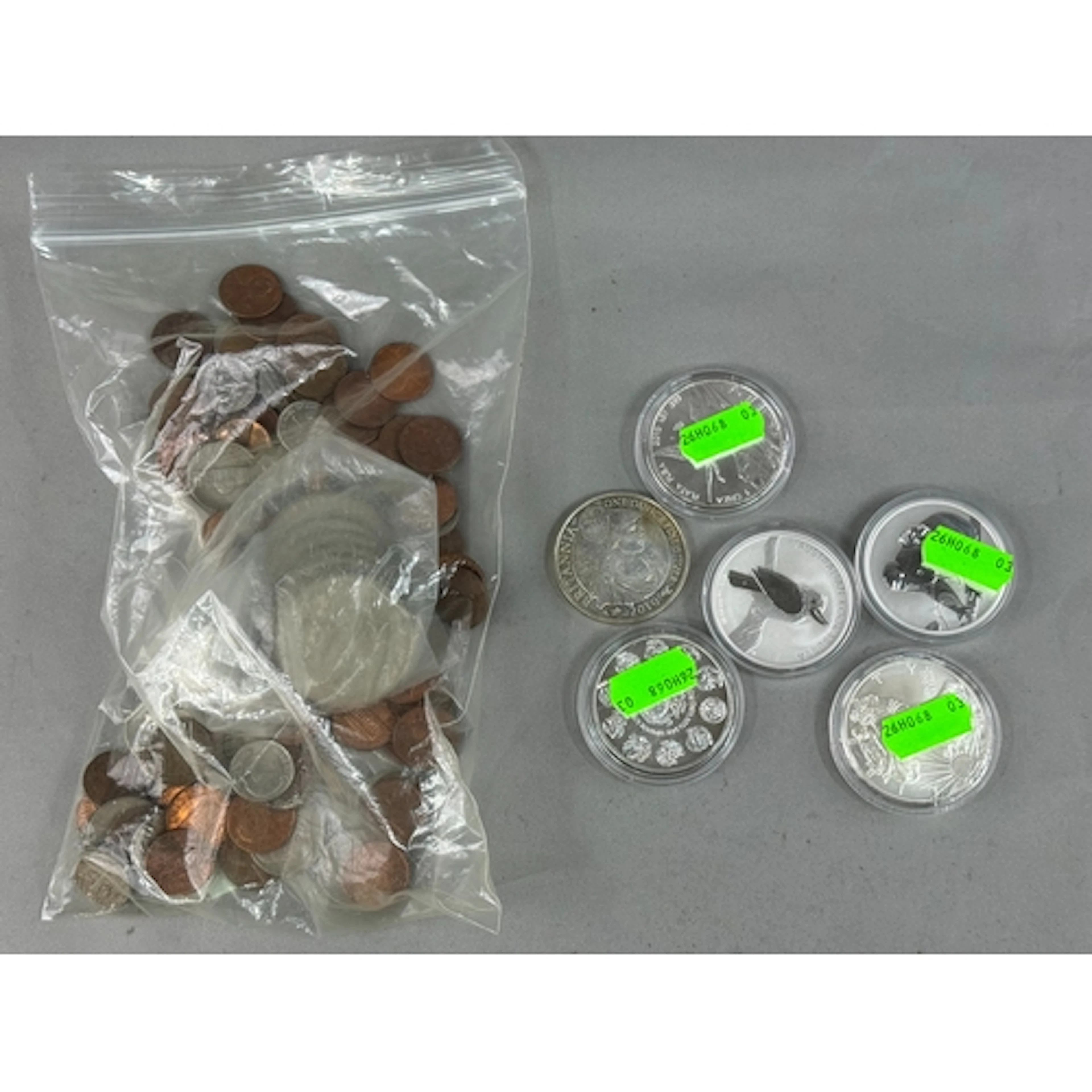 Coins: an Australian 2010 kookaburra one ounce pure silver d...