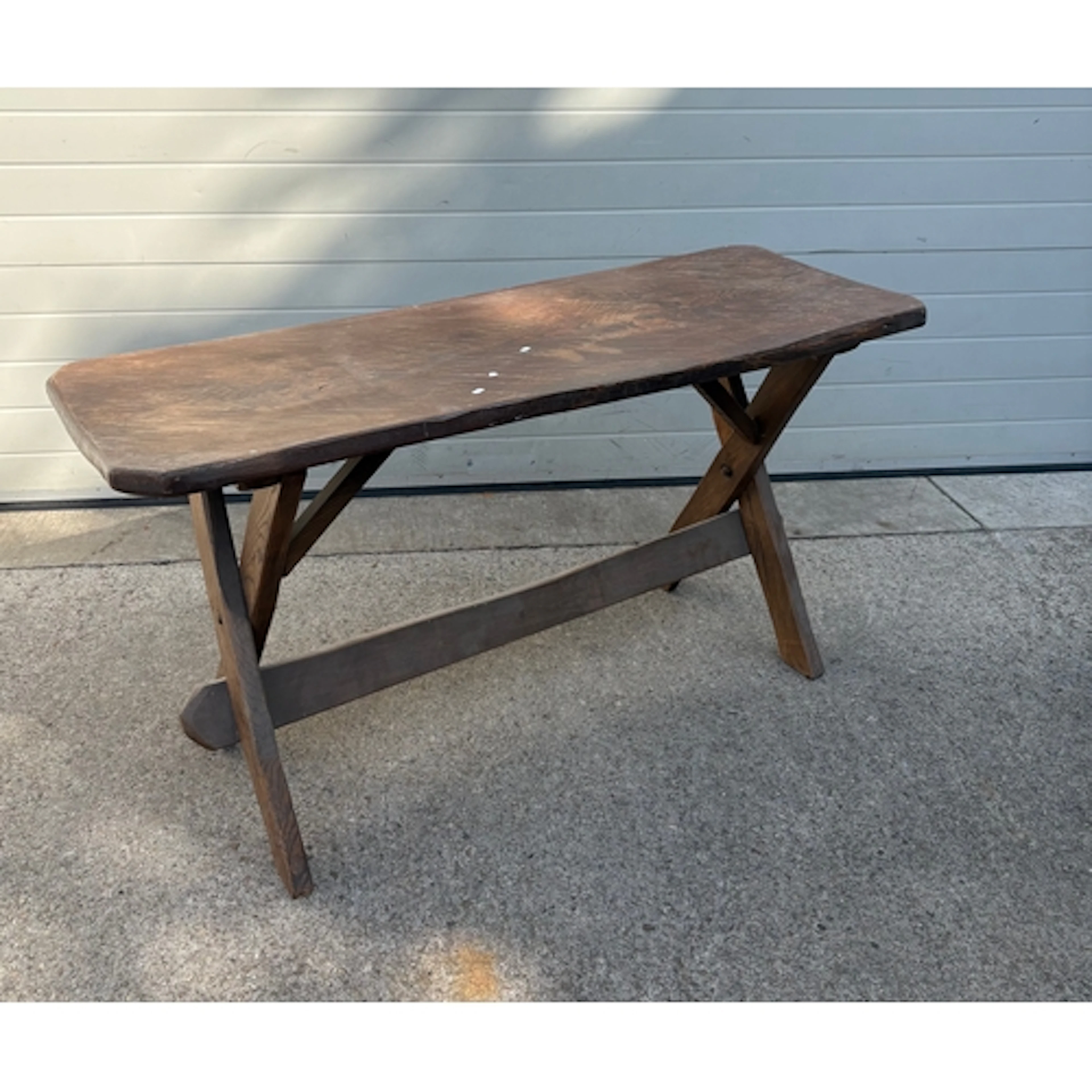 A narrow oak dining table