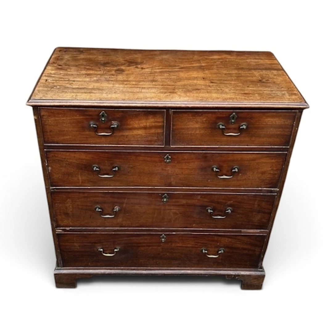 A GEORGE III MAHOGANY CHEST OF TWO SHORT AND THREE LONG DRAW...