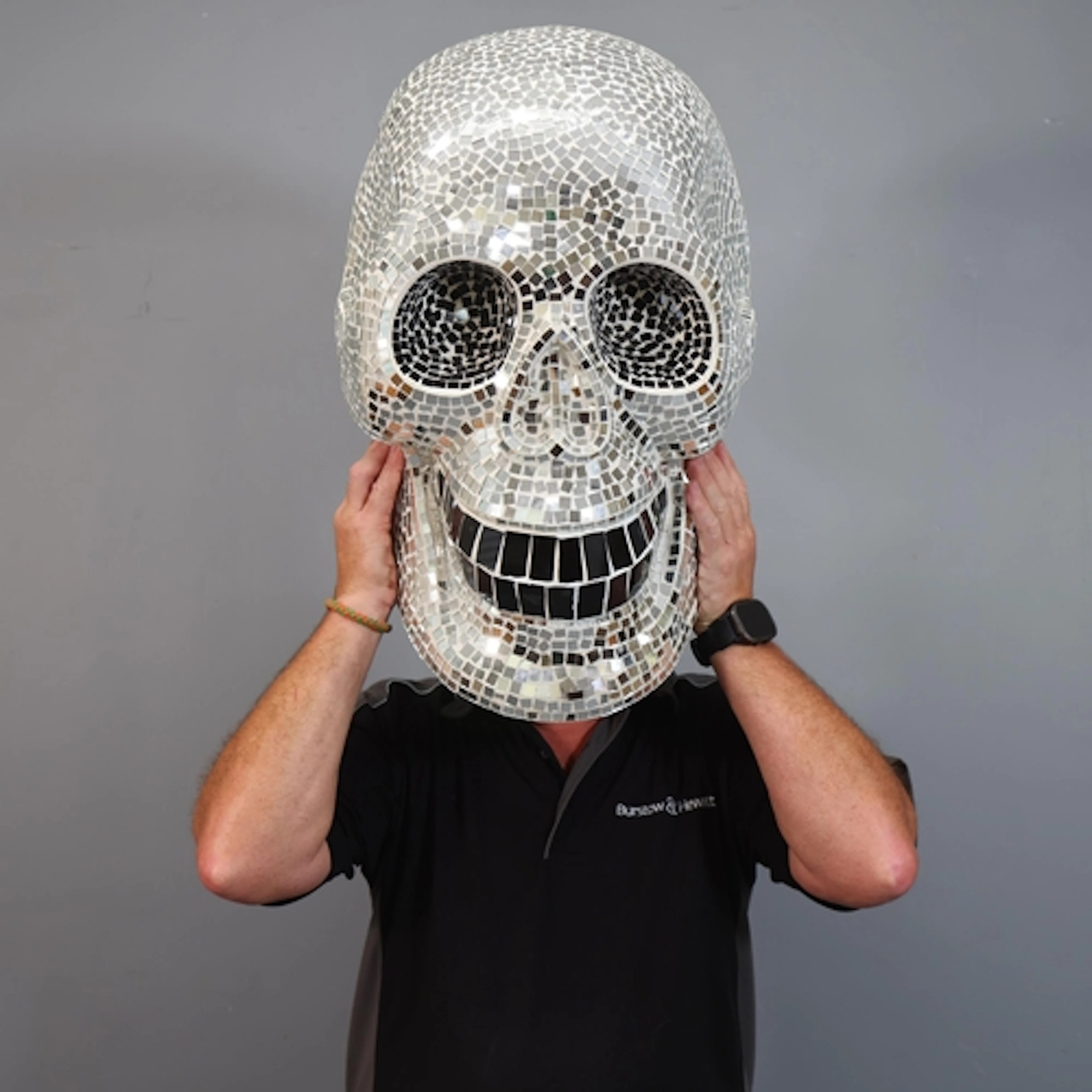 Giant Mirror Disco Skull An enormous human skull, with hund...