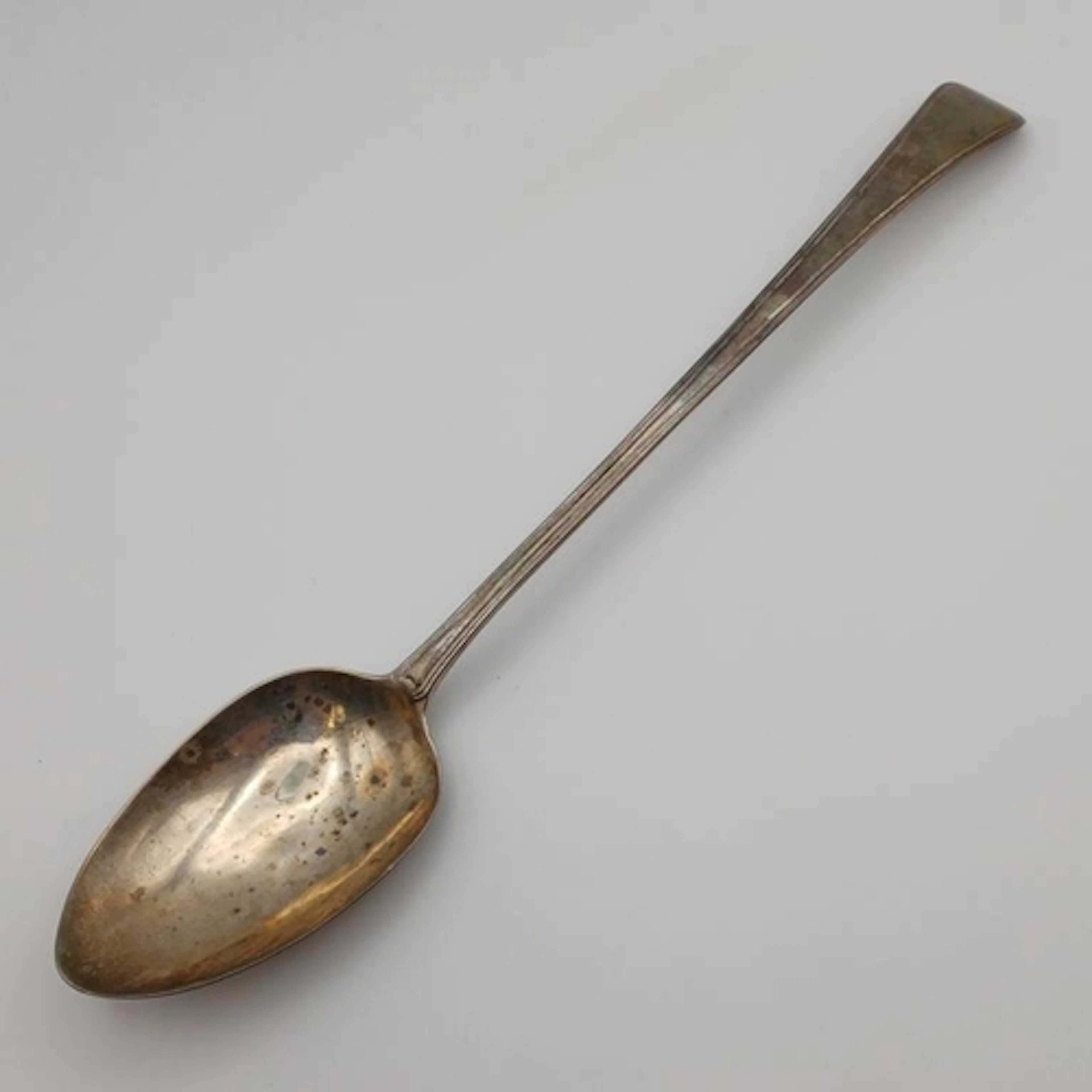 A GEORGE III SILVER SERVING SPOON BY GEORGE WINTLE, LONDON 1...