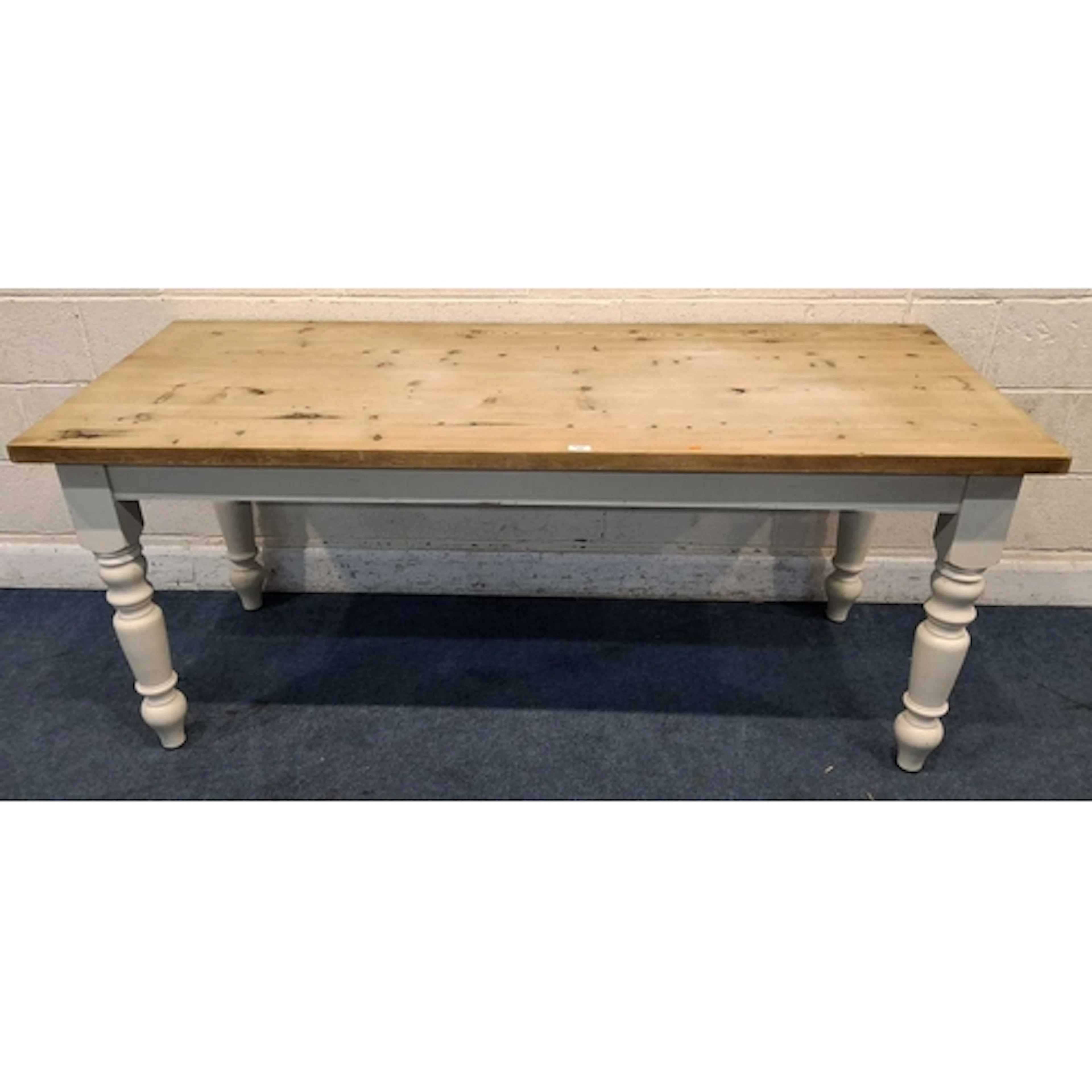 A PARTIALLY PAINTED PINE FARMHOUSE STYLE TABLE, raised on bl...