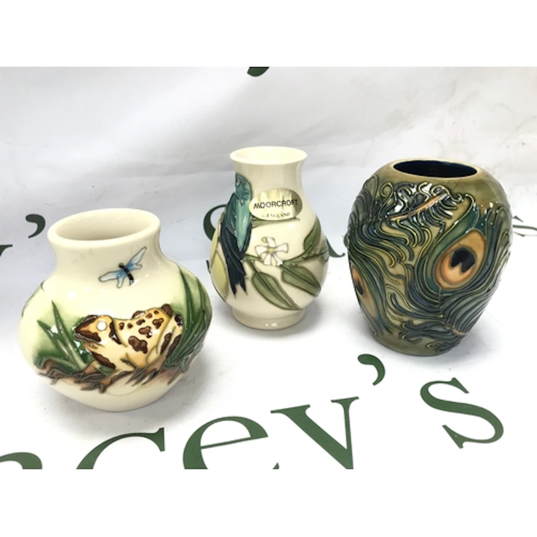 Three Moorcroft vases 8 to 10cm tall