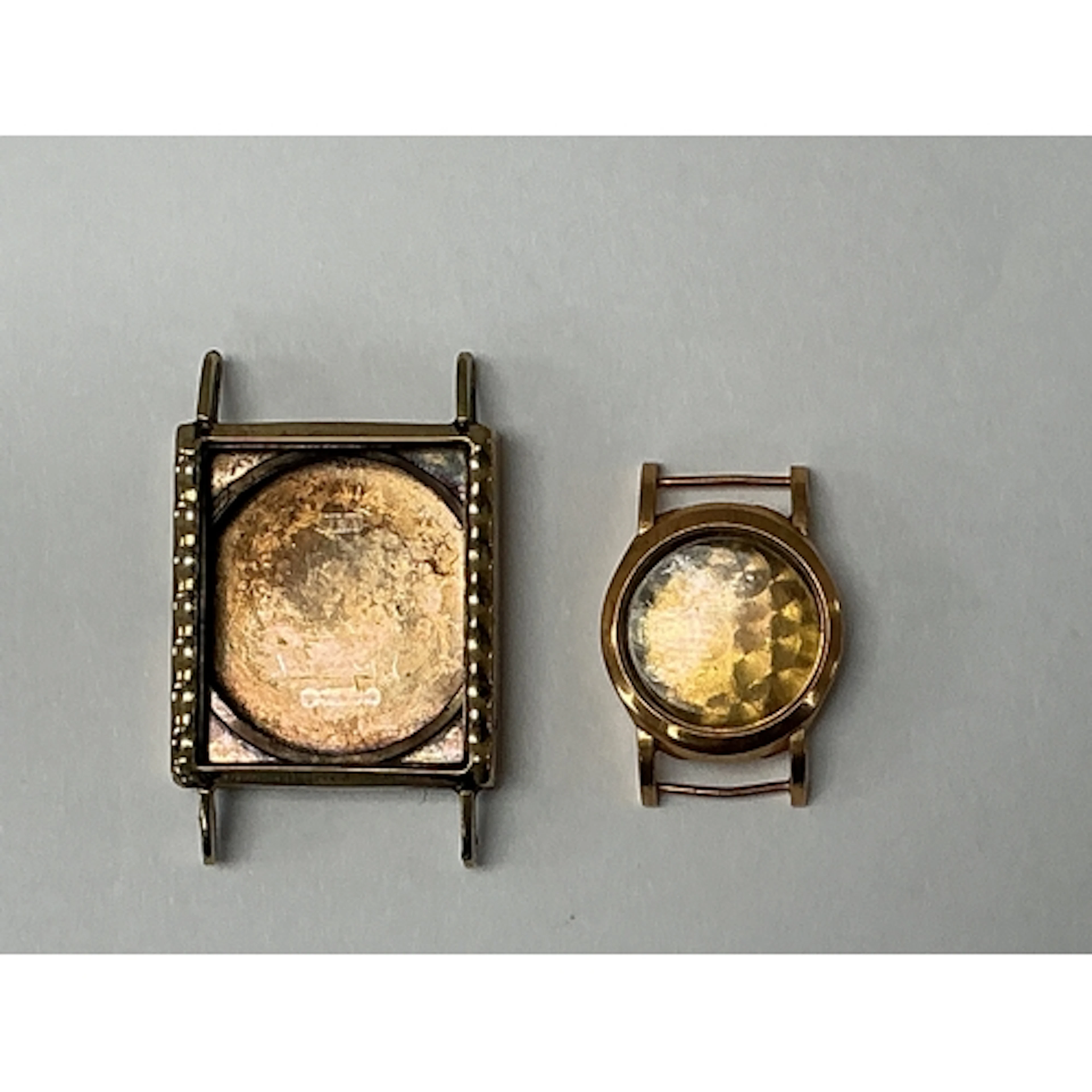 Two gold, empty watch cases, hallmarked 18k and 9ct respecti...