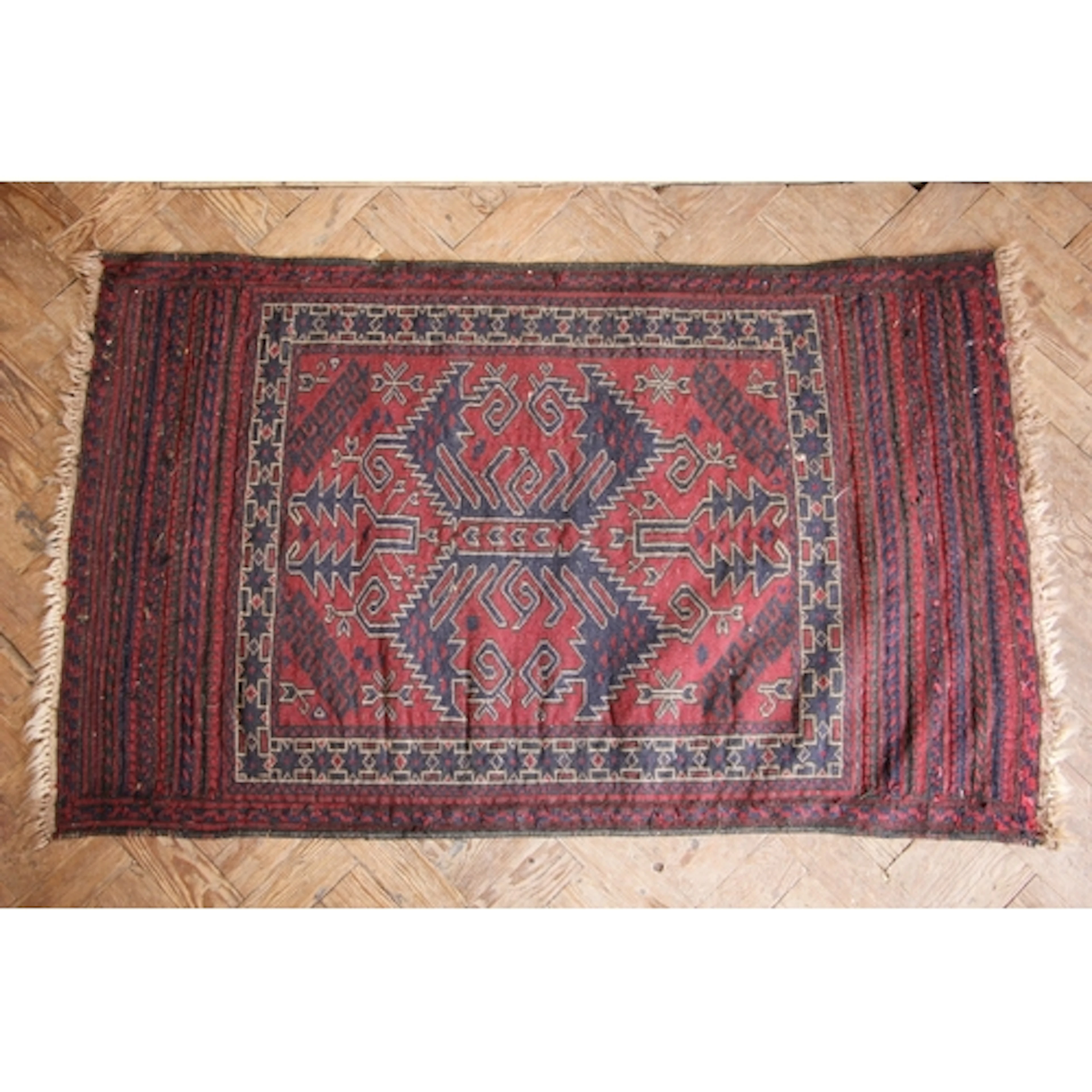An Afghan Baluch hand-knotted wool village rug, in cobalt an...
