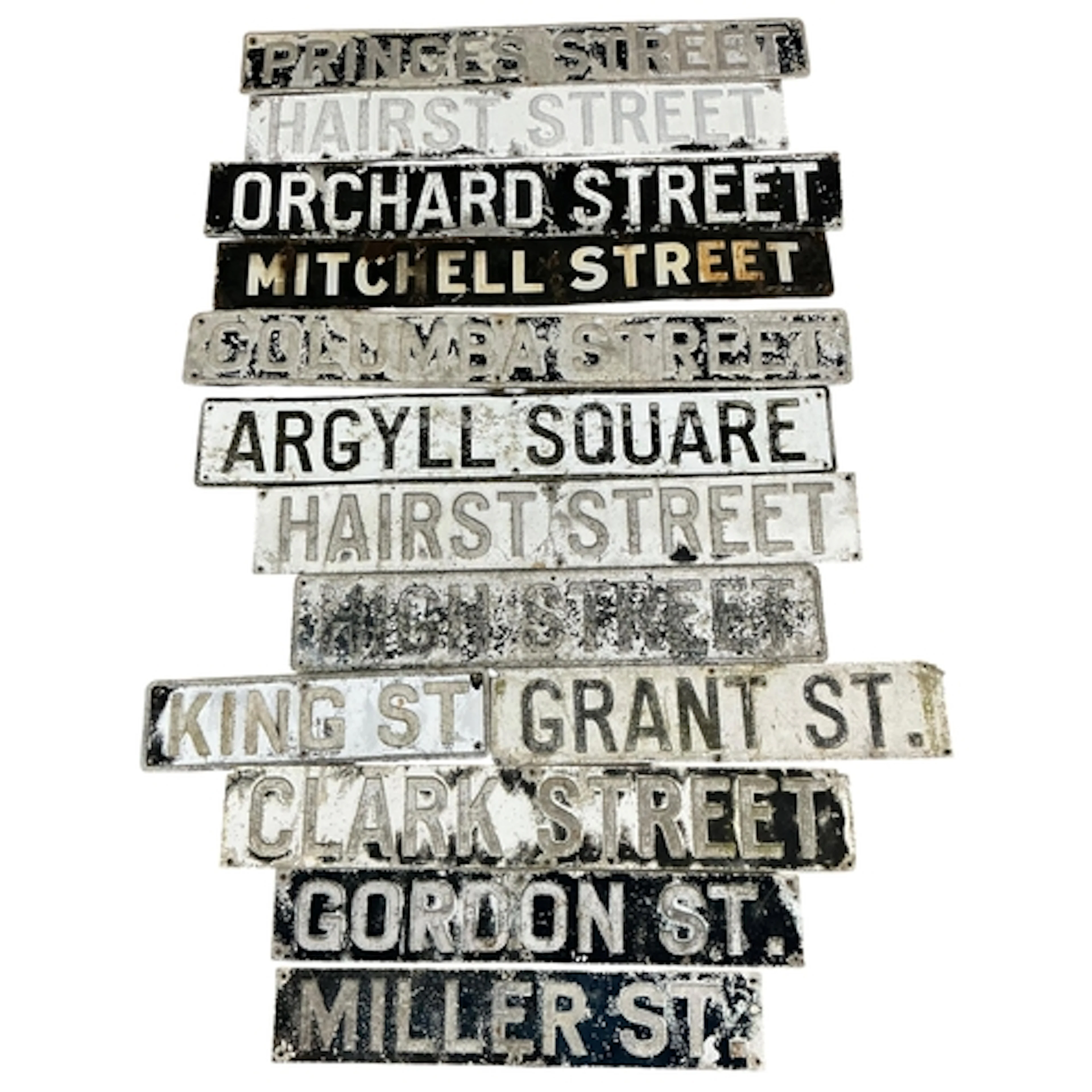 Thirteen, mainly pressed metal, vintage street signs