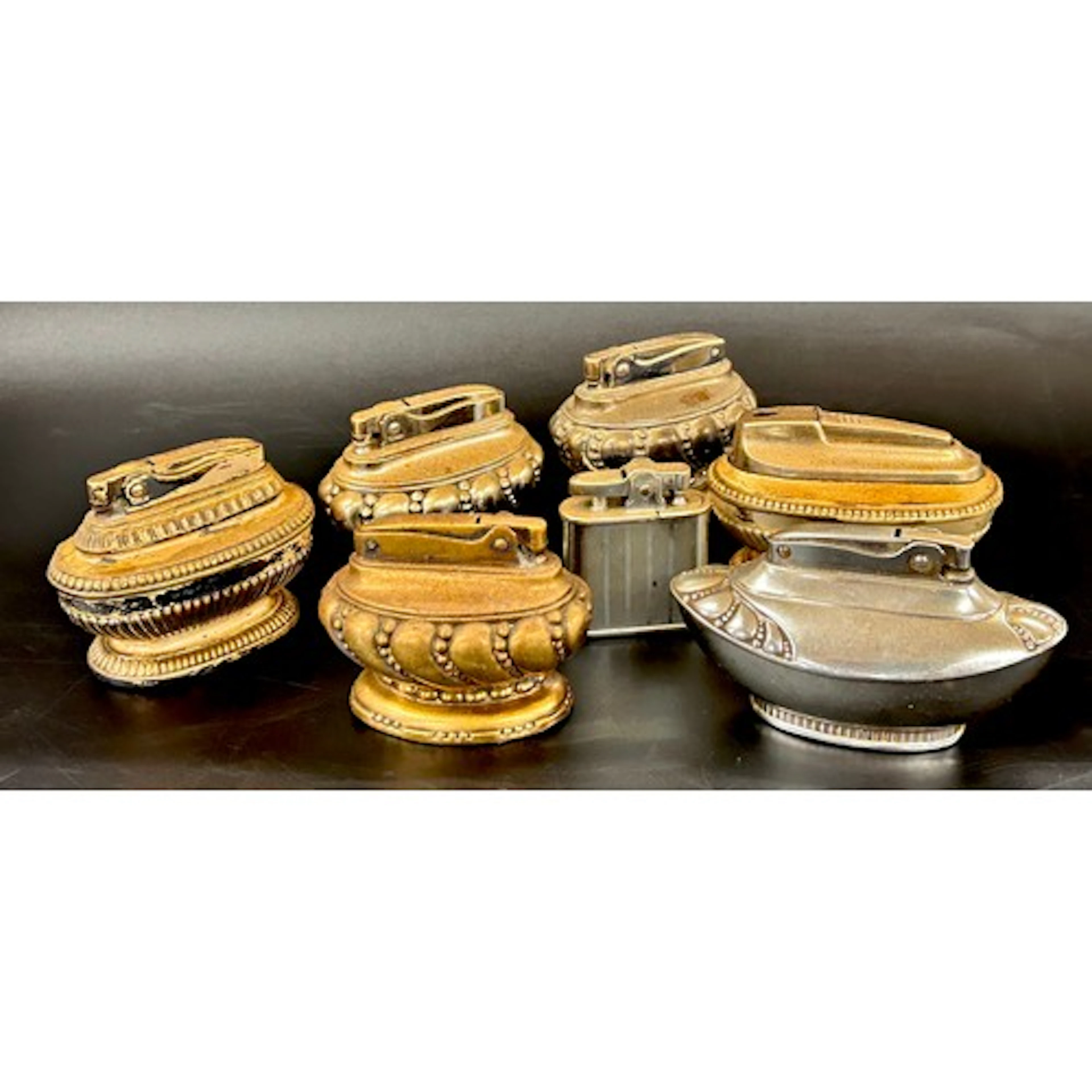 A collection of seven Ronson table lighters *Not available ...