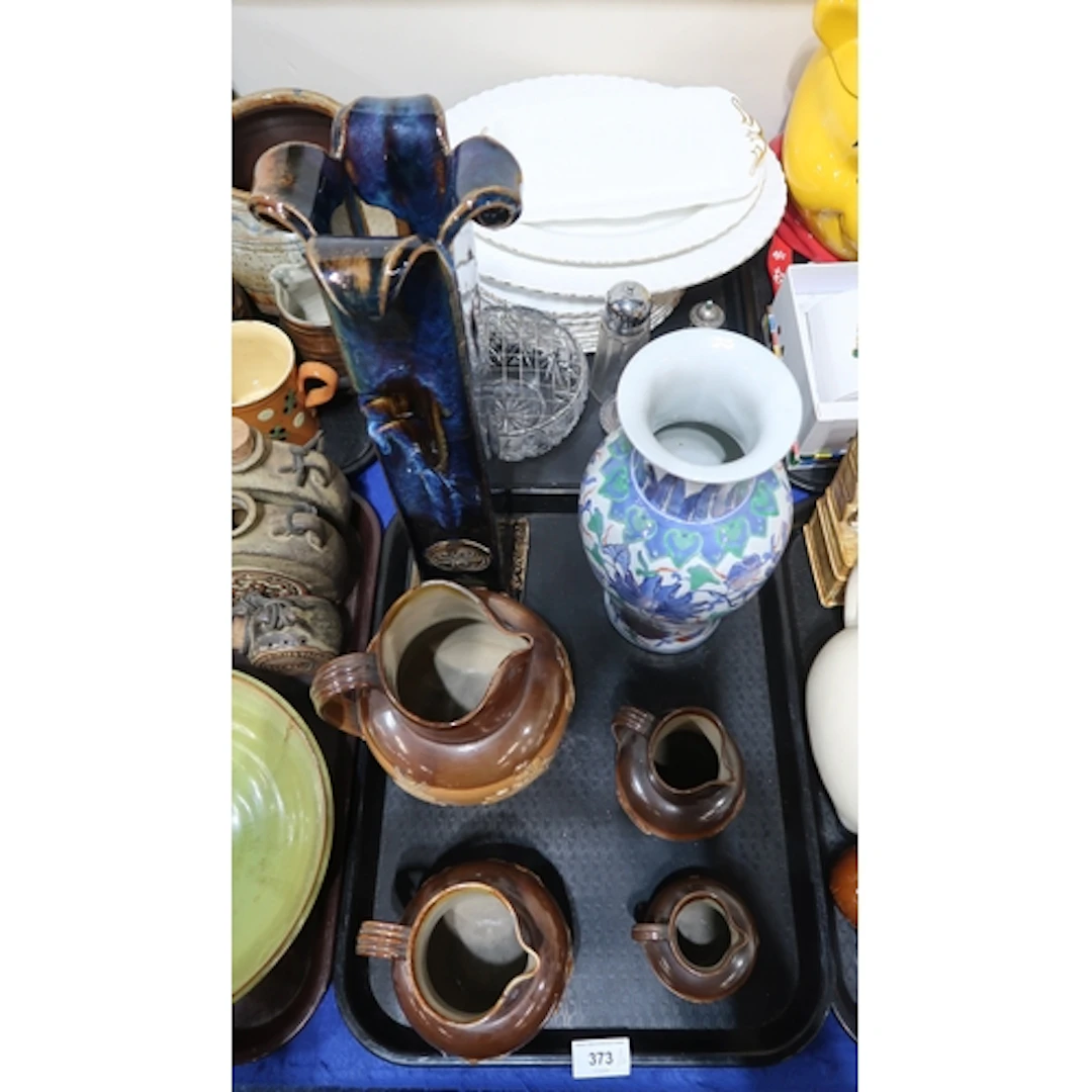 Four Doulton Lambeth stoneware jugs of graduating sizes, a C...