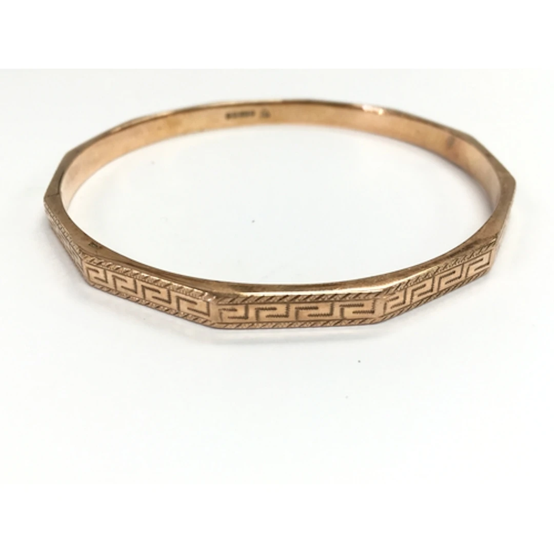 A 9ct gold bangle. 81mm diameter and 12.23g