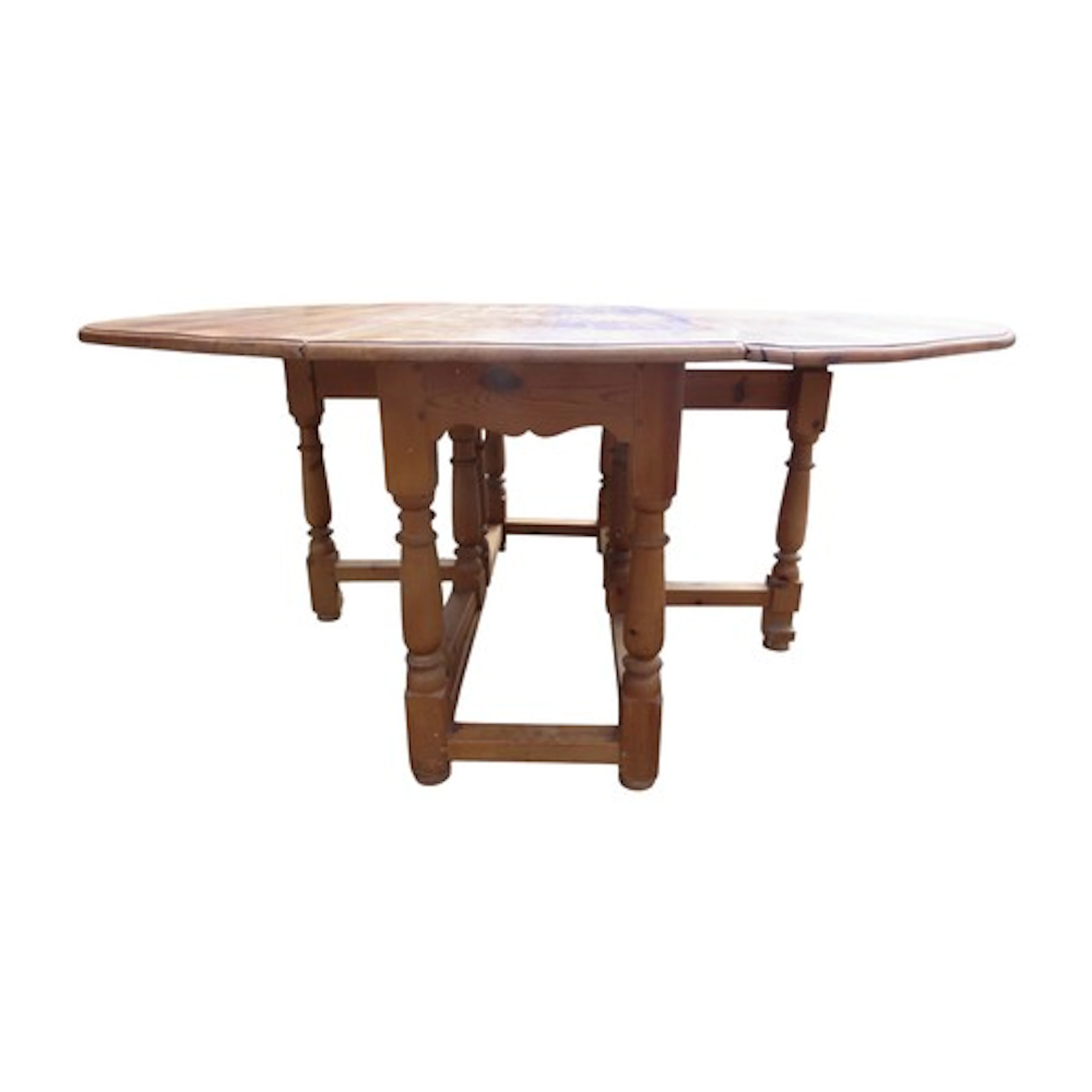 A large stripped pine oval drop leaf gateleg dining table r...