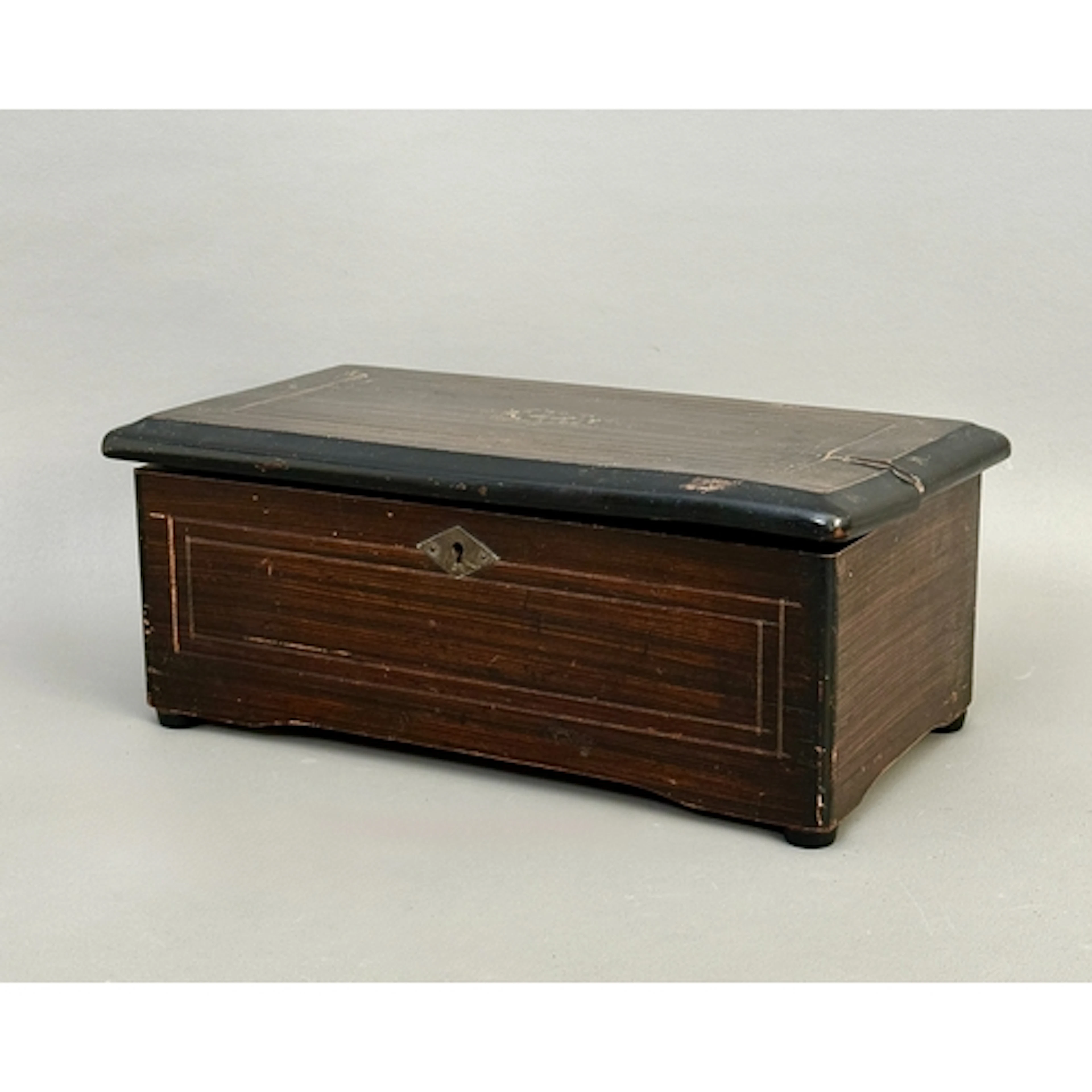 A small 19th century Swiss imitation rosewood six air music ...