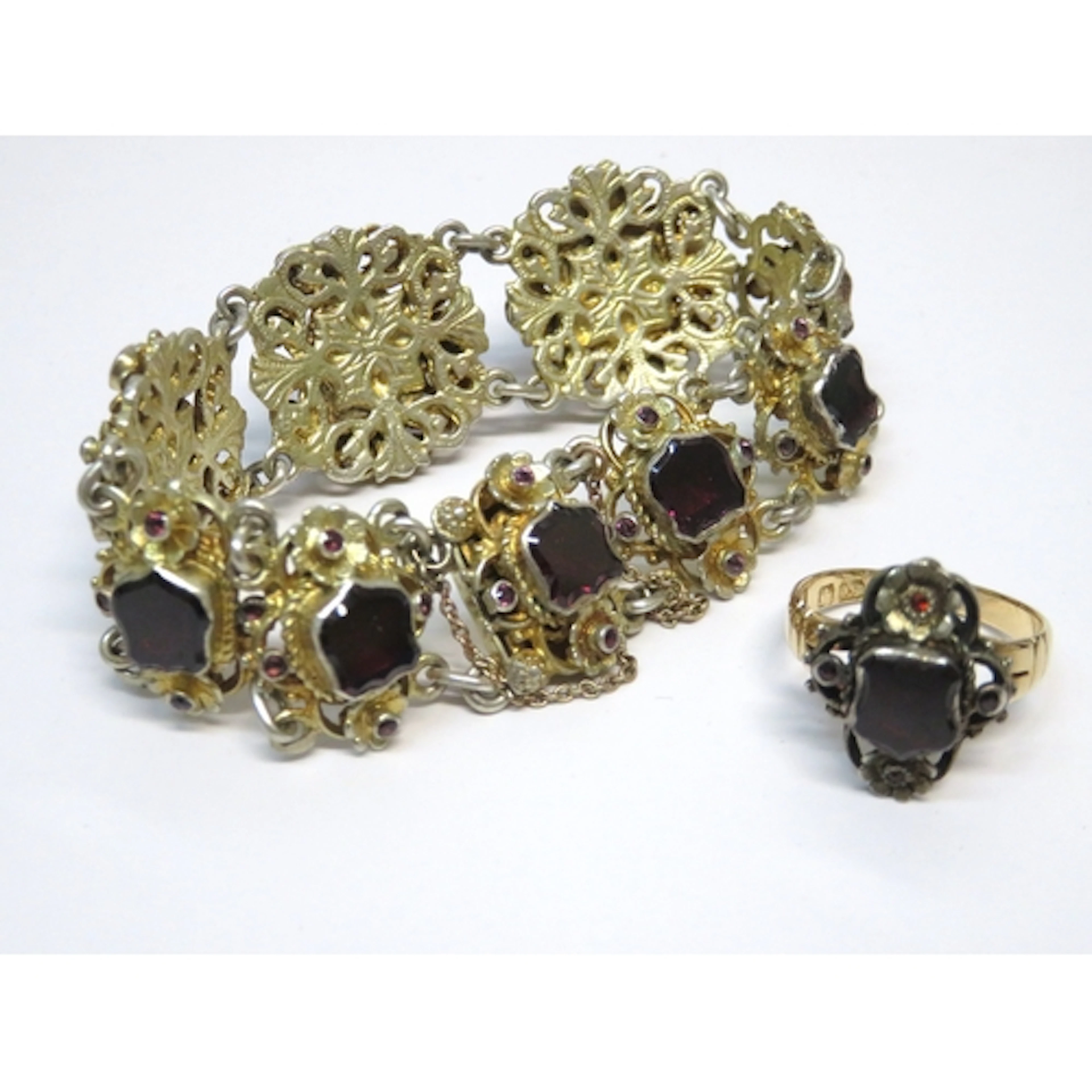 Continental white metal and garnet set ring head, mounted on...