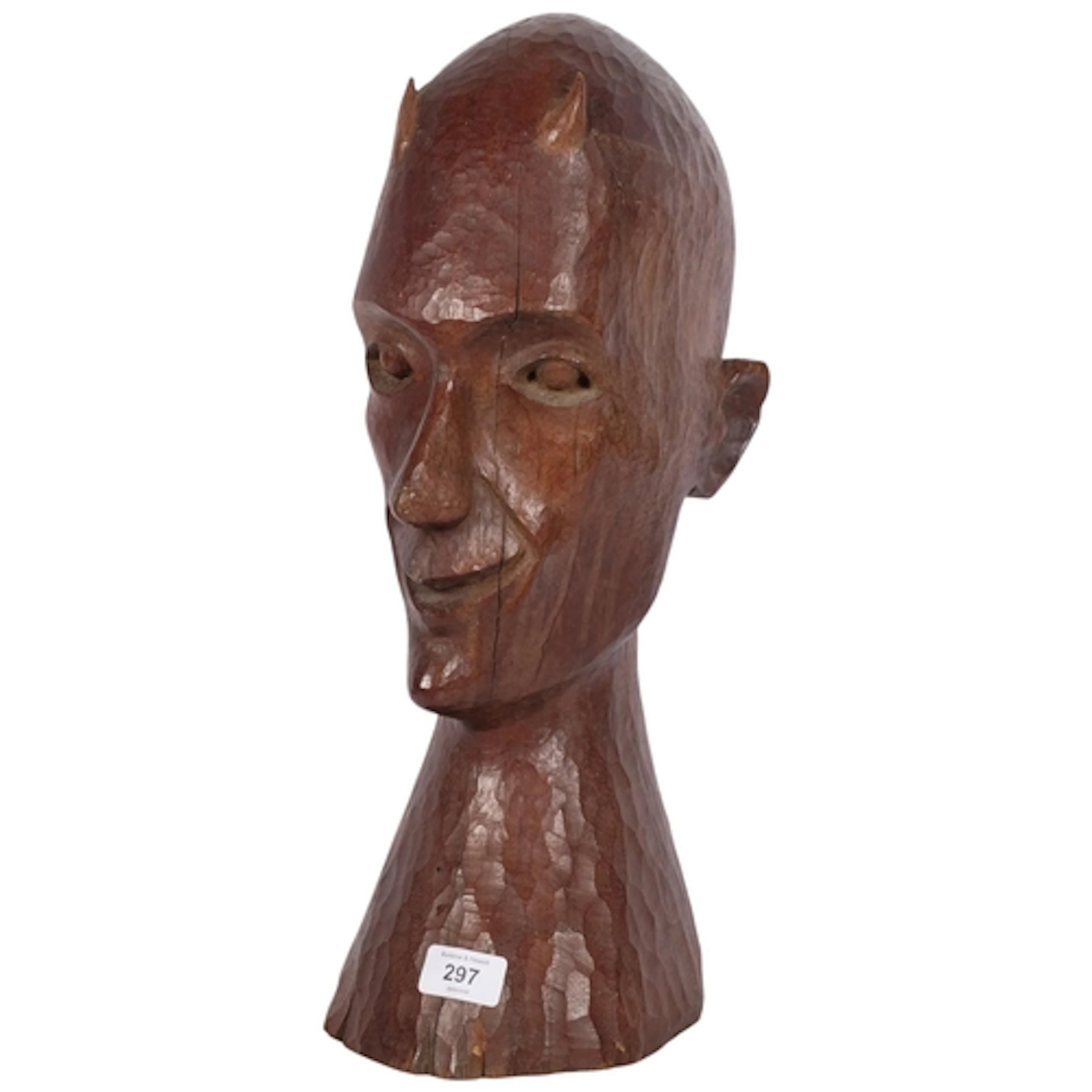 A carved textured wood sculpture, bust of horned figure, H46...