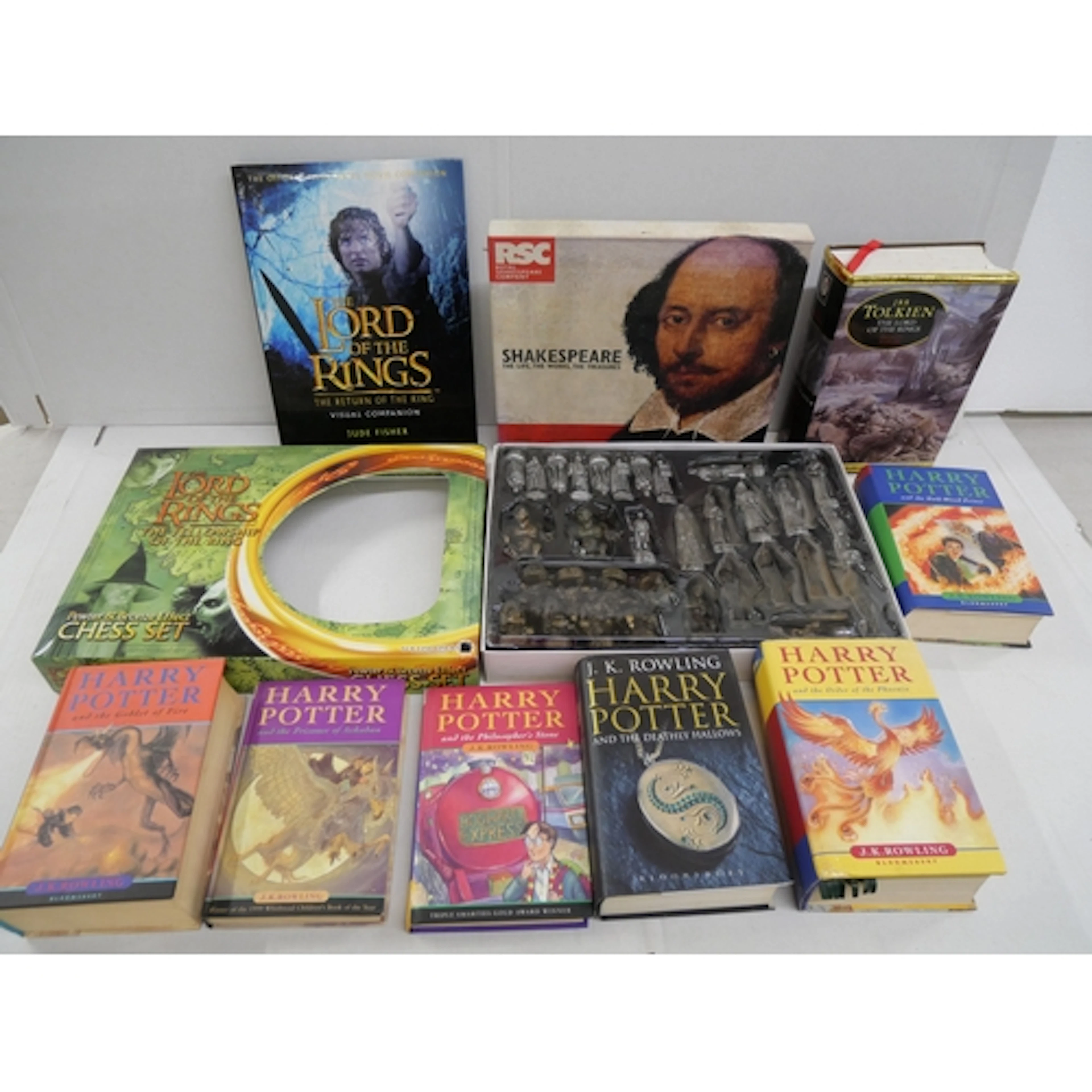 A collection of books including Lord of the Rings, Harry Pot...