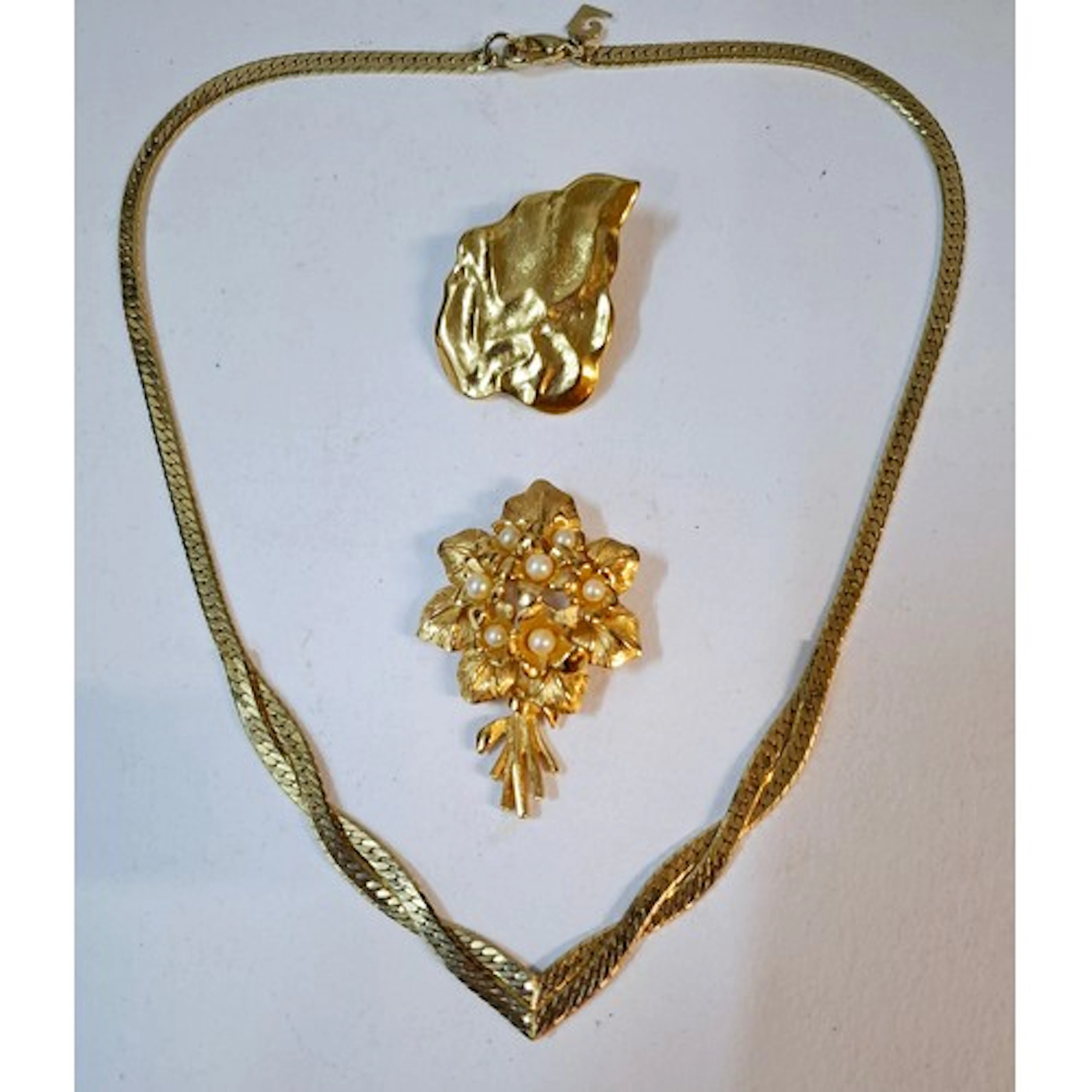 YSL- A small lot comprising an Yves Saint Laurent gold tone ...