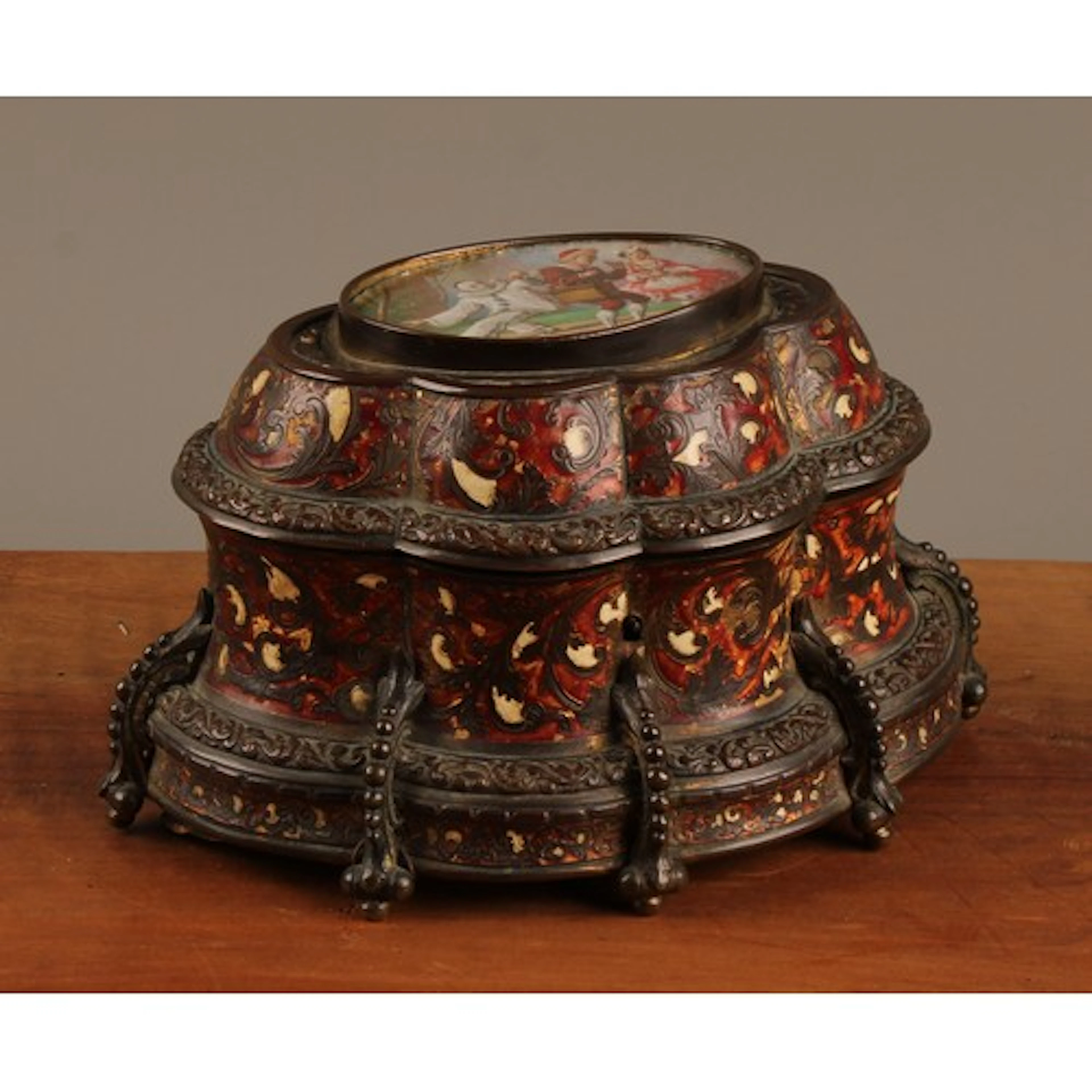 A Continental cold painted brass faux boulle fluted oval mus...