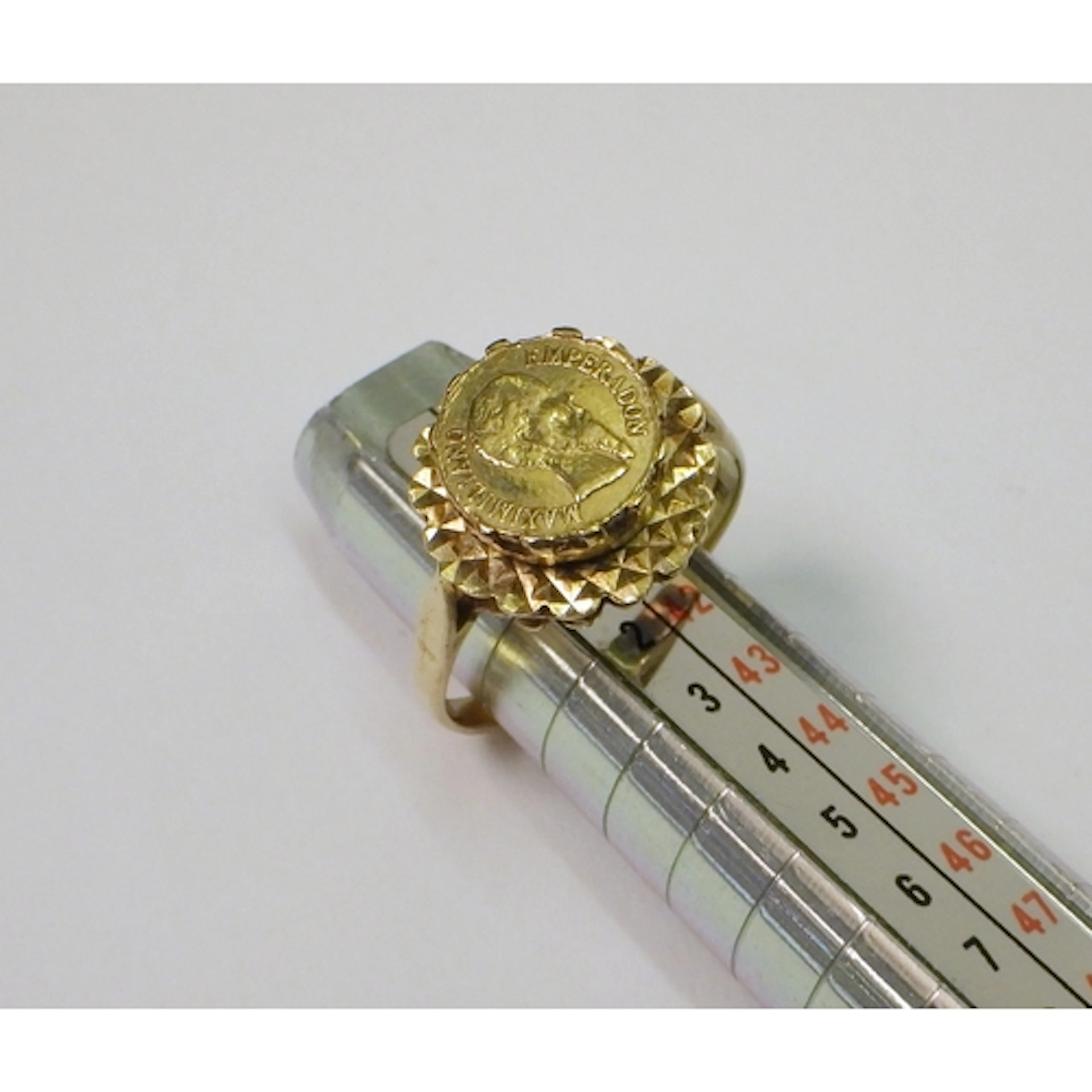 A signet ring, 9ct gold inset with a yellow metal token depi...