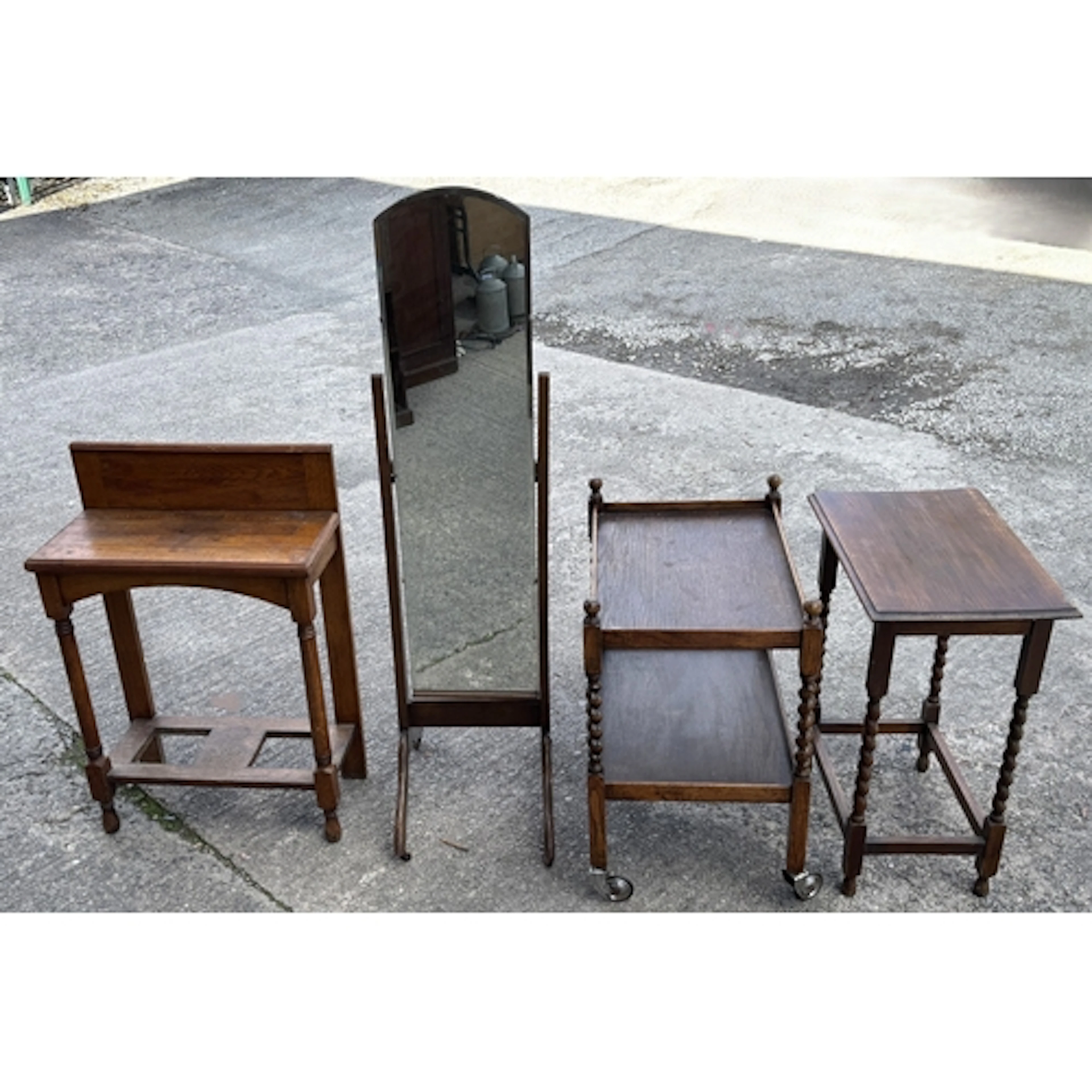 An oak cheval mirror, tea trolley, hall table and occasional...