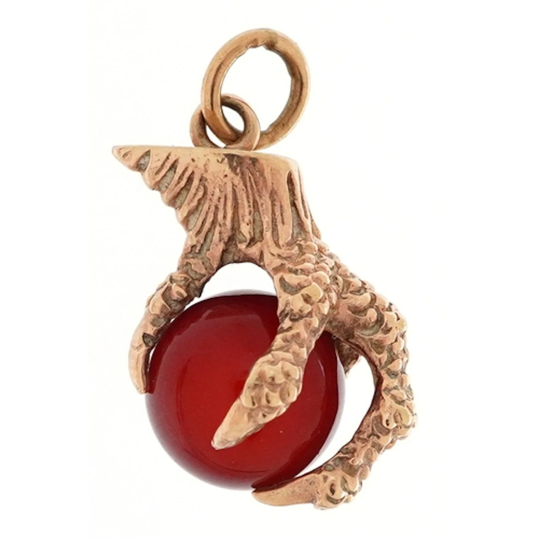 9ct gold and carnelian ball and claw charm, 2cm in length, 4...