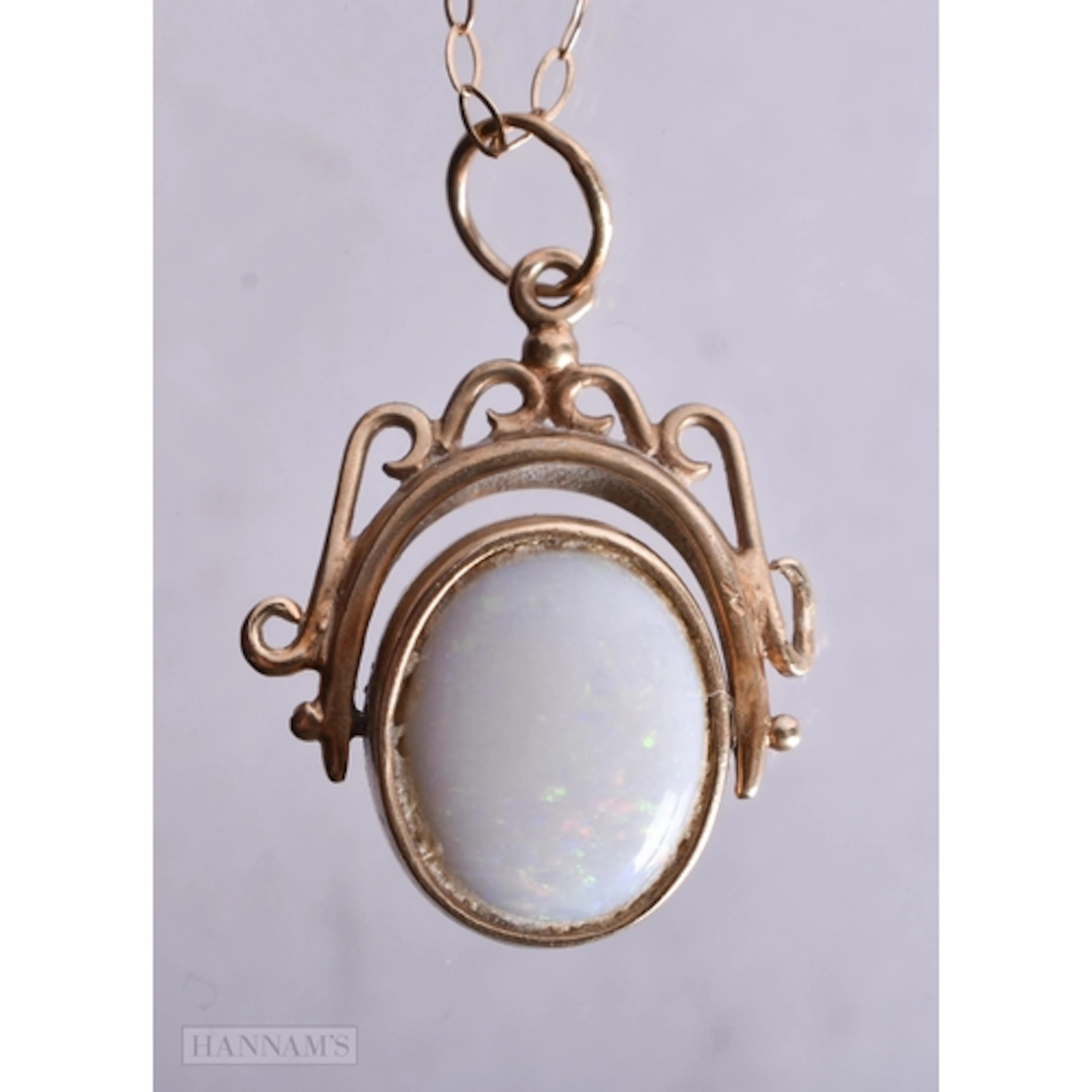 9ct gold opal and garnet spinner pendant necklace (2.9g). 42...