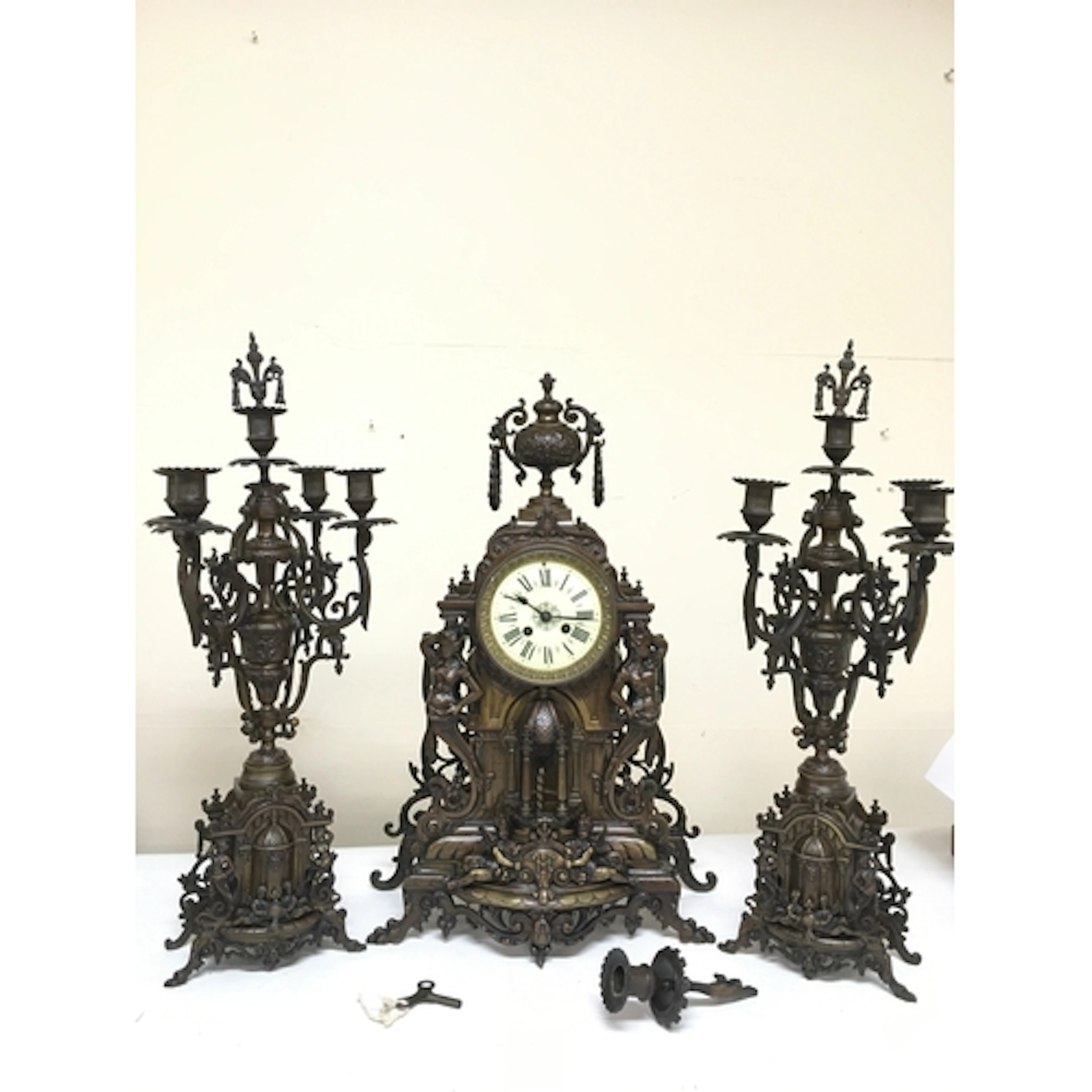 An Ornate Gothic revival architectural design clock featurin...