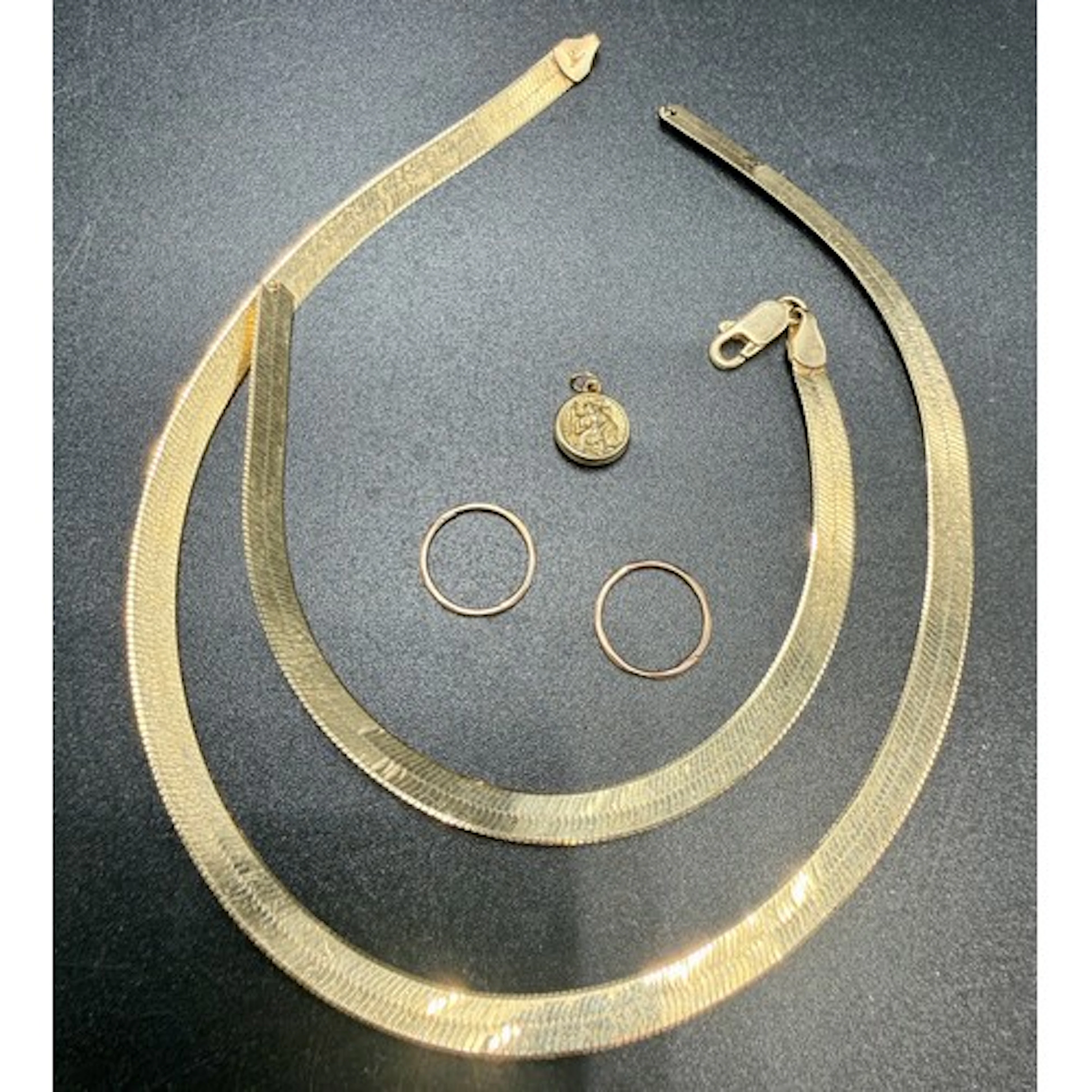 A broken 9 carat gold necklace together with 9 carat gold St...