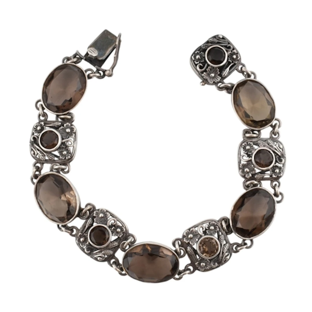 A 1970s hallmarked silver and smoky quartz Arts and Crafts s...