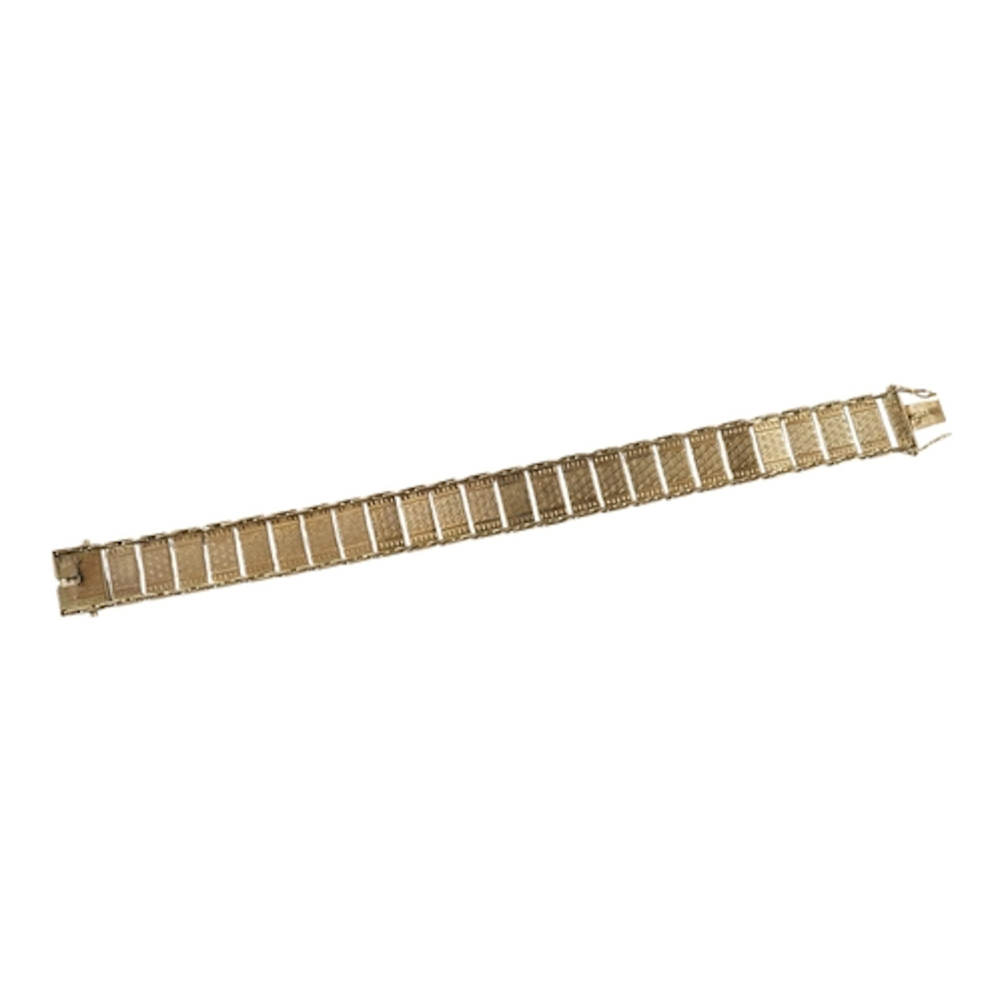 A gold bracelet, composed of panel links with engraved decor...