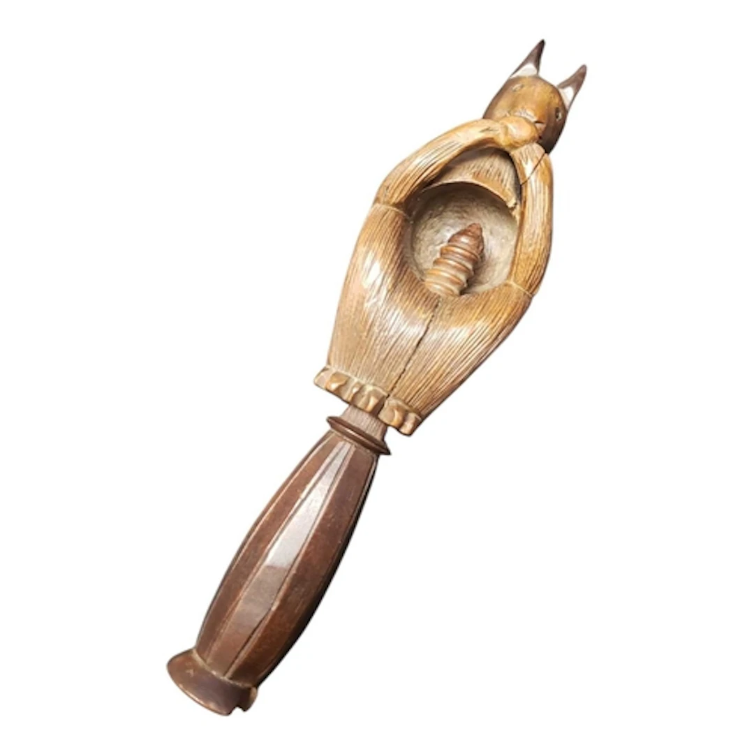 A late 19th century black forest wooden carved squirrel shap...
