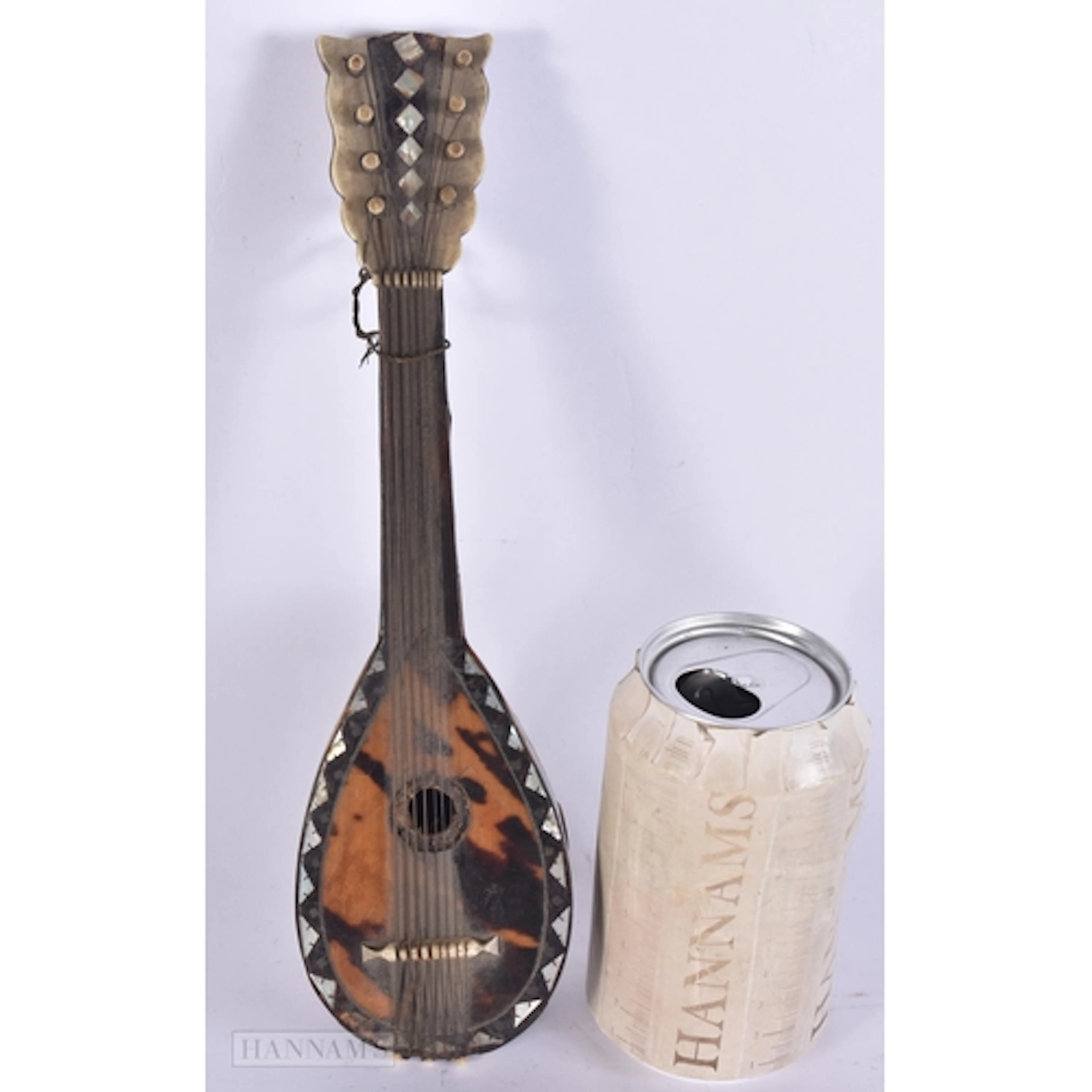 AN UNUSUALLY LARGE ANTIQUE TORTOISESHELL MODEL OF A MANDOLIN...