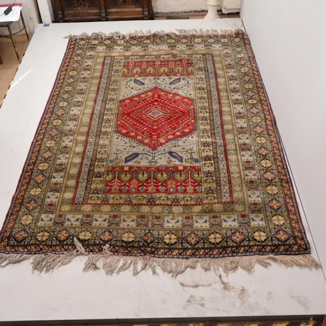 A large green and ivory ground Moroccan carpet L288cm, W203c...