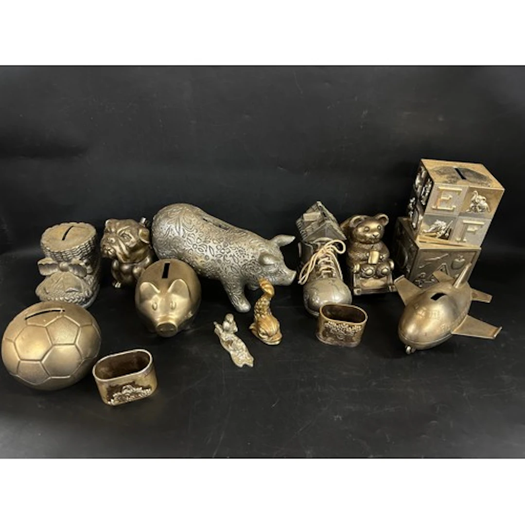 A collection of metal / plated money boxes *Not available f...