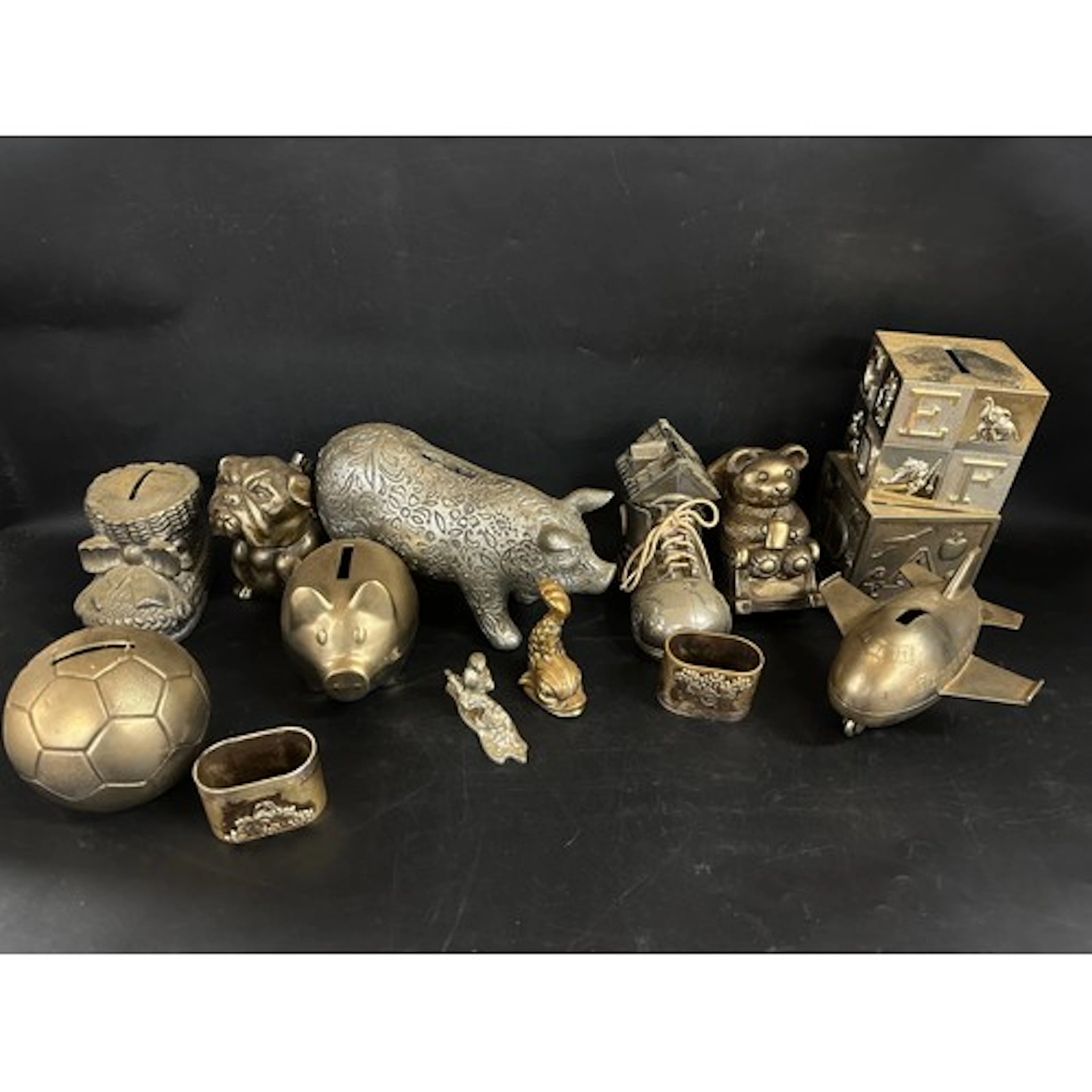 A collection of metal / plated money boxes *Not available f...