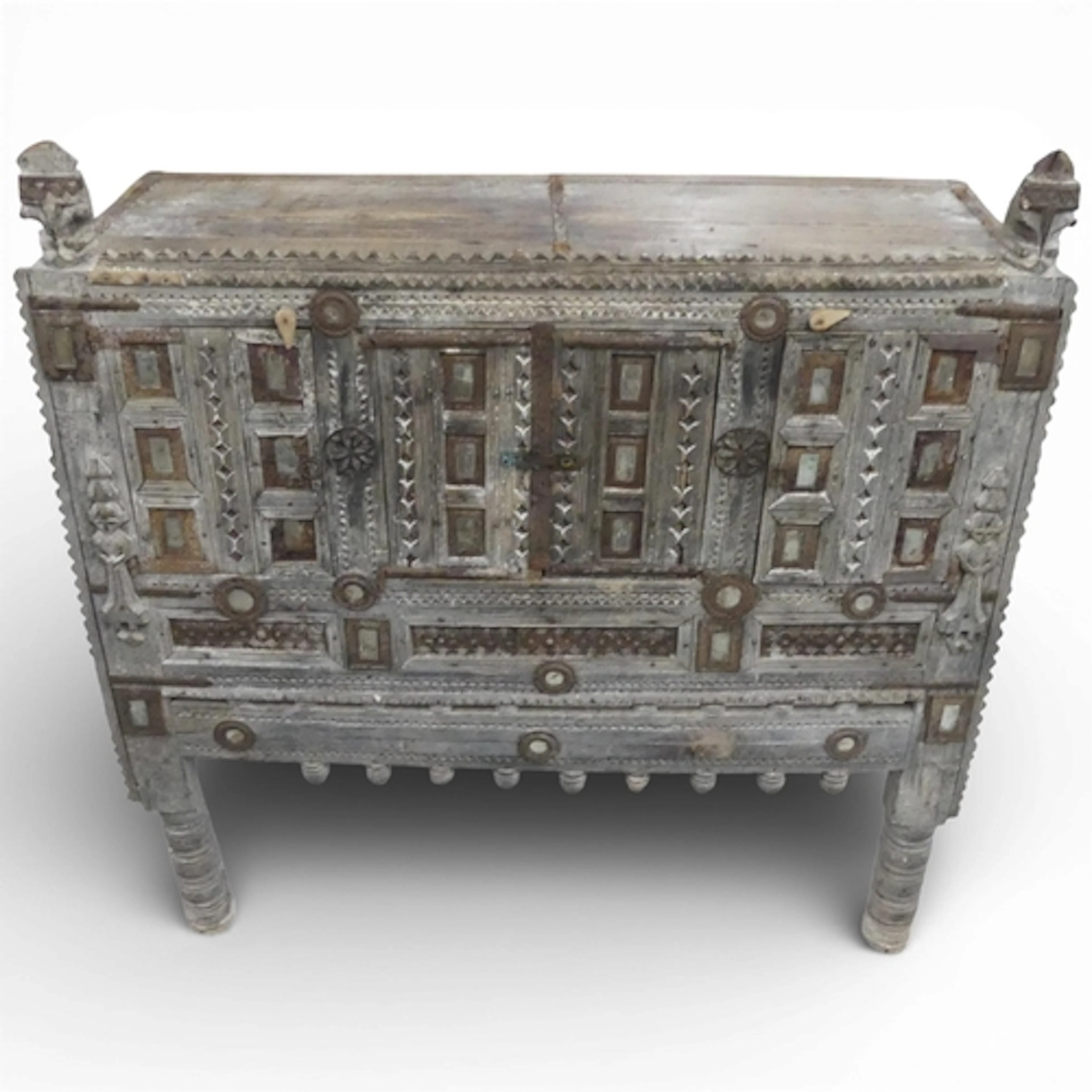 An Indian hardwood damchiya dowry chest, with ornately carve...