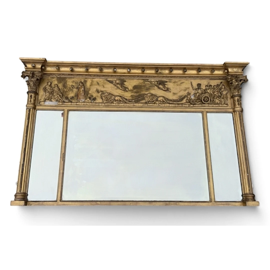 A REGENCY GILTWOOD OVERMANTLE MIRROR With neoclassical friez...