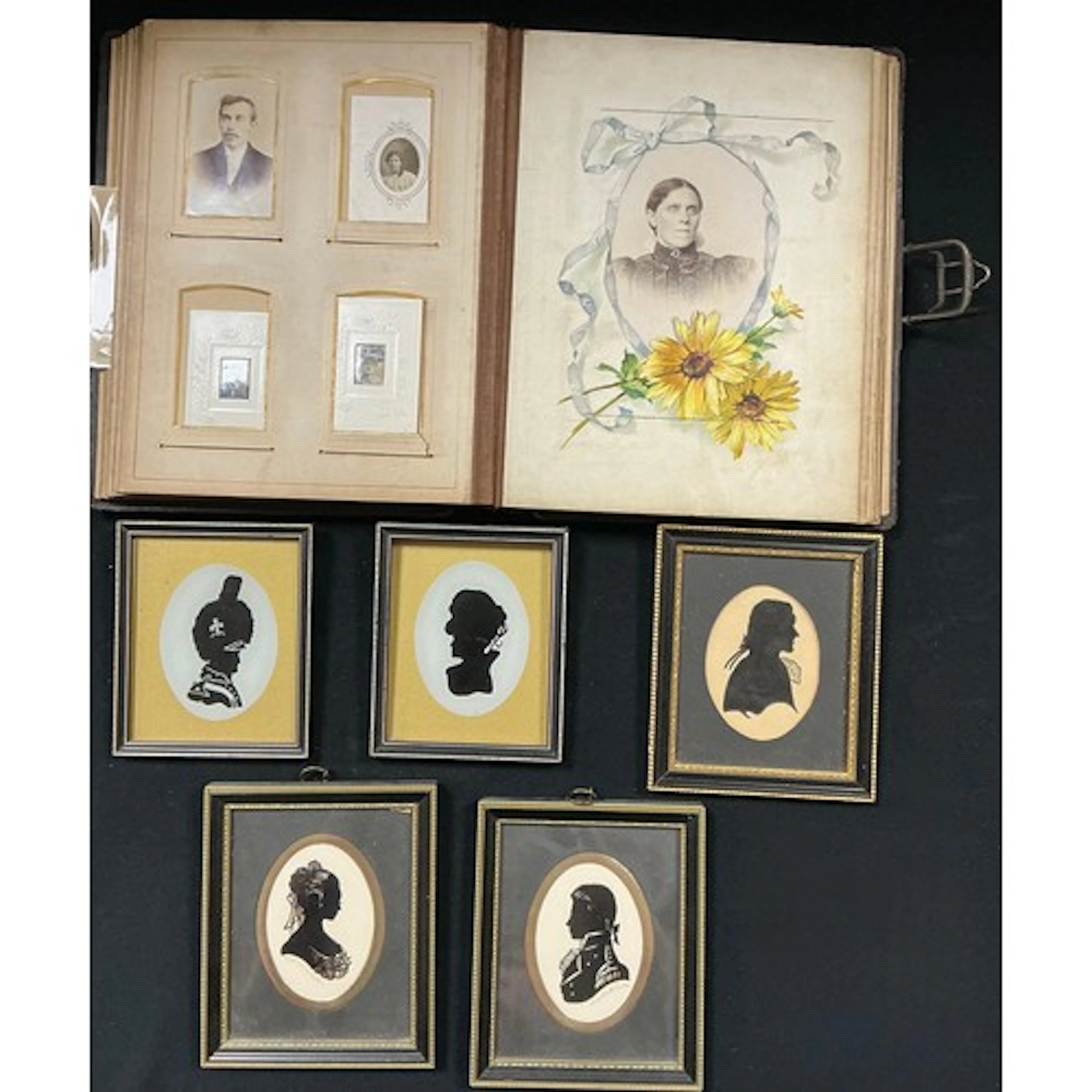 A Victorian leather bound photo album including family photo...