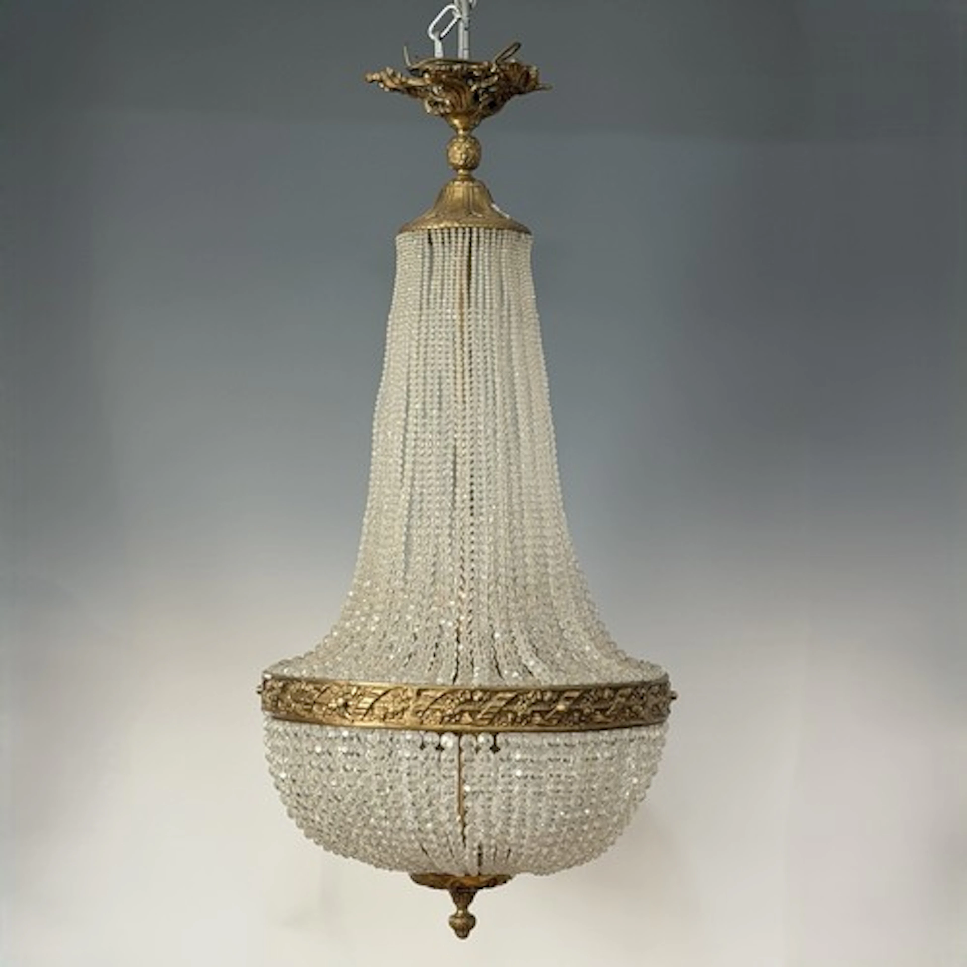 An antique French tent and waterfall Chandelier, decorated w...