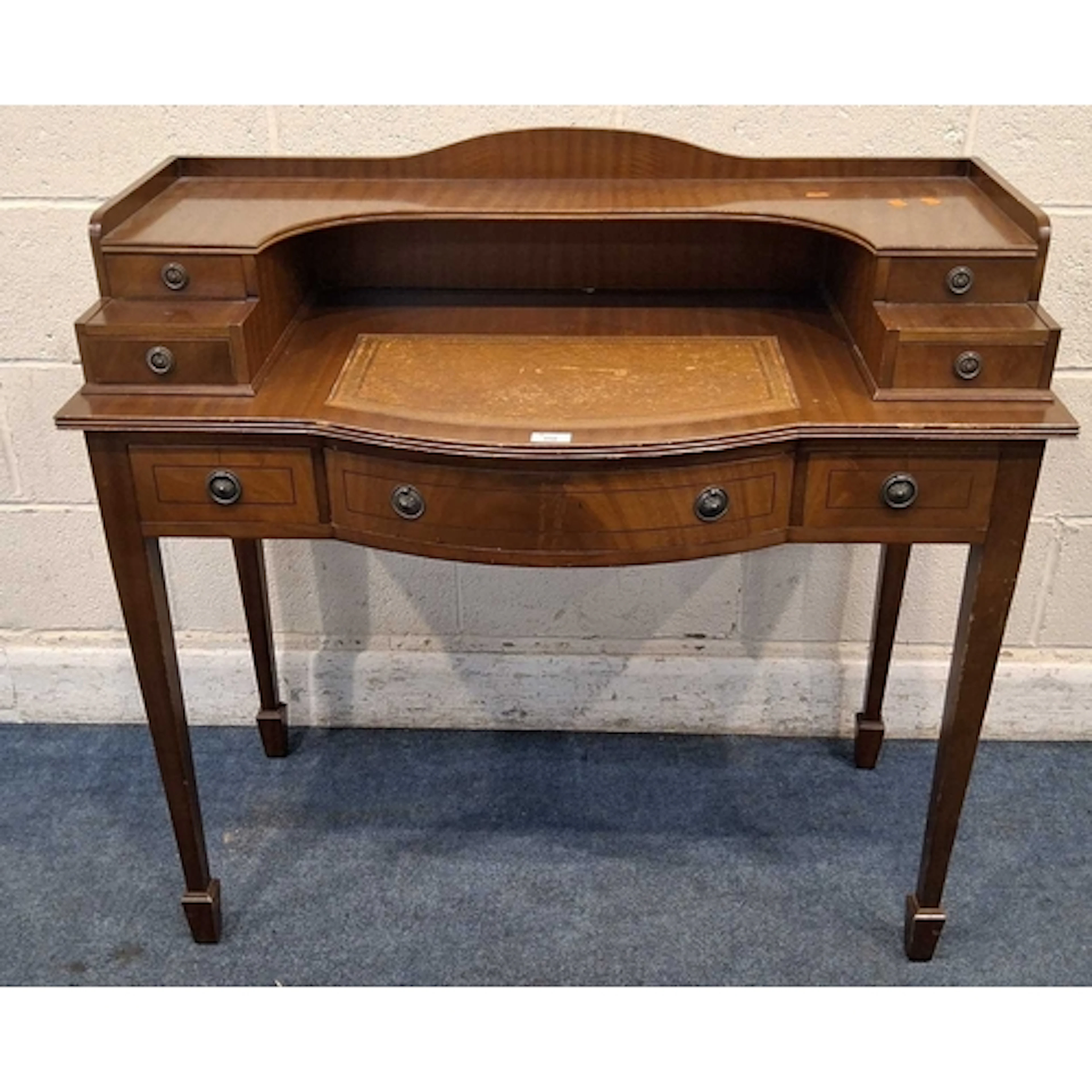A REPRODUCTION MAHOGANY DESK, fitted with seven assorted dra...