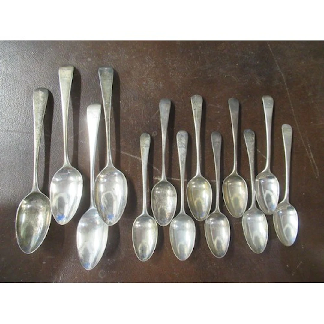 A set of 9 Georgian silver dessert spoons, together with a m...