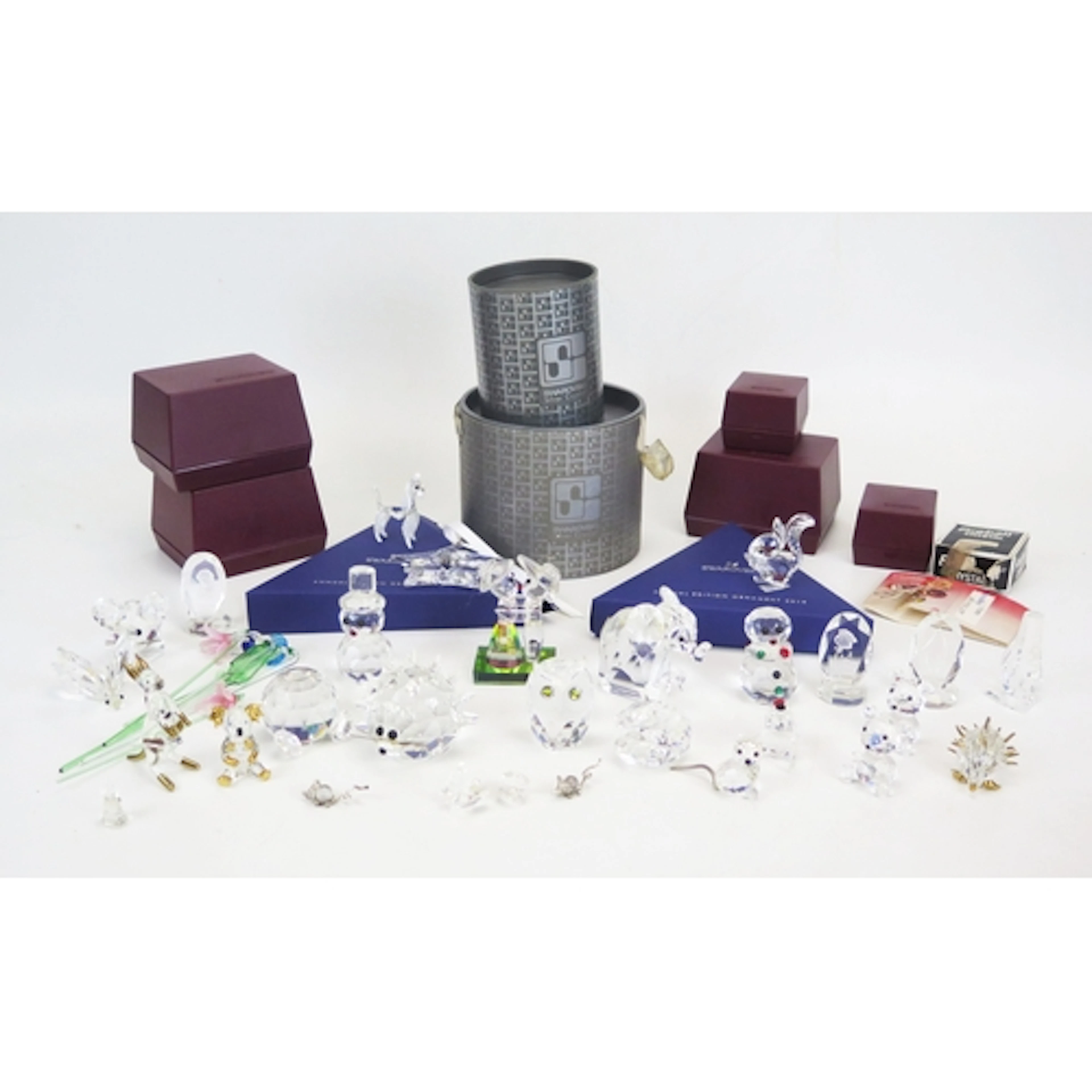 A collection of Swarovski crystal novelty figures and animal...