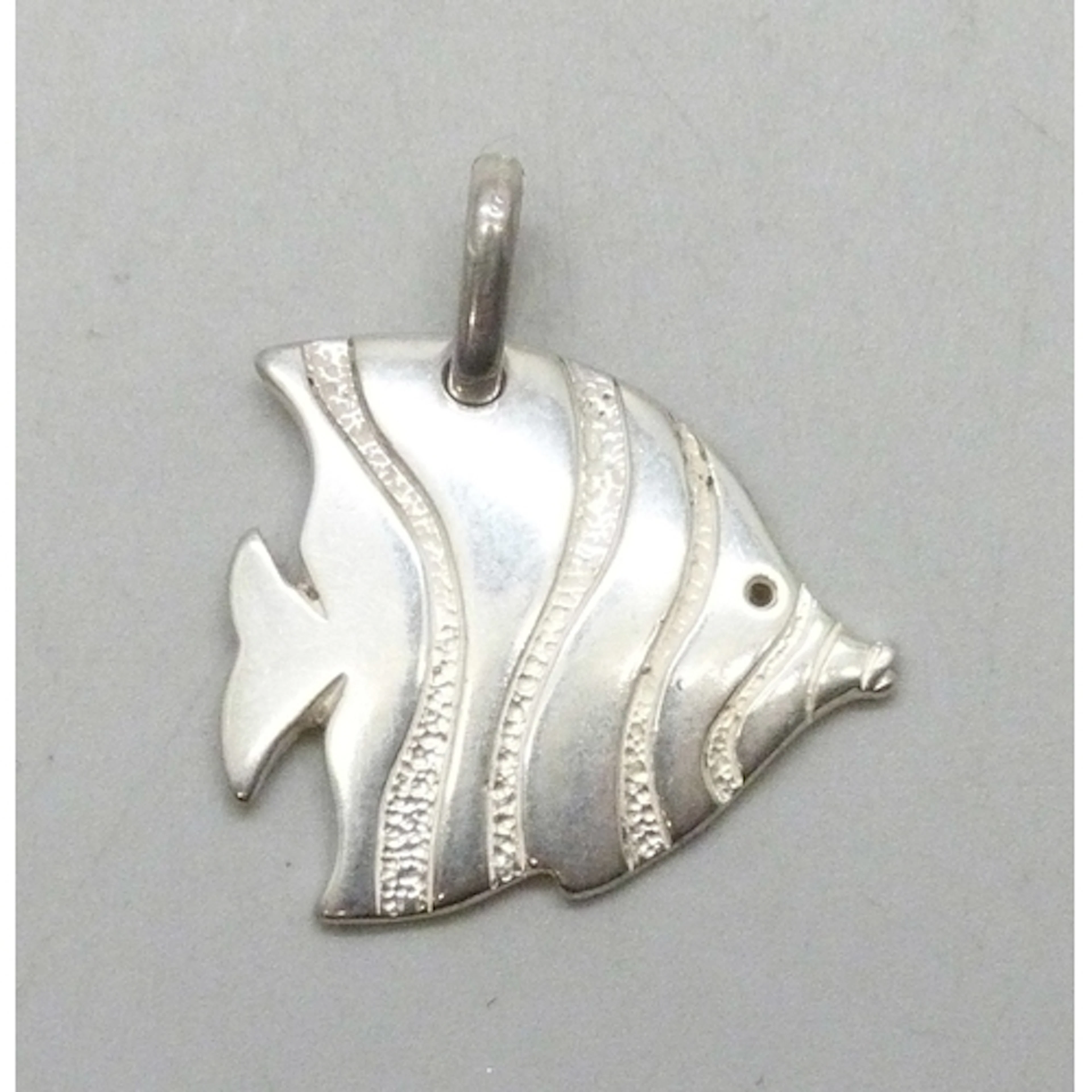 A silver pendant in the form of a fish, 3cm including bail