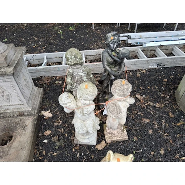 FOUR CONCRETE GARDEN FIGURES comprising a painted mother and...