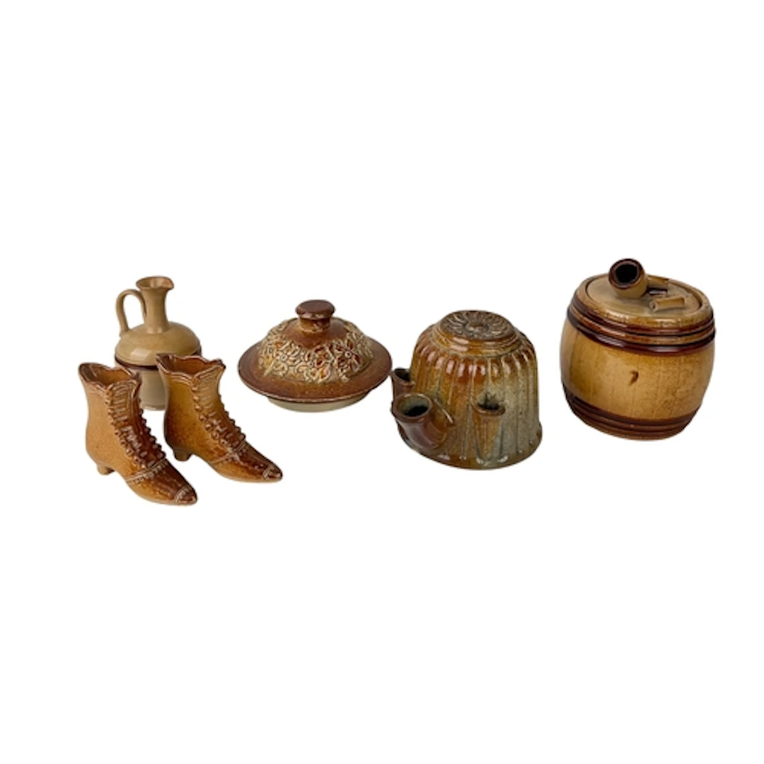 AN ENGLISH 19TH CENTURY SALT-GLAZED STONEWARE FUDDLING CUP A...